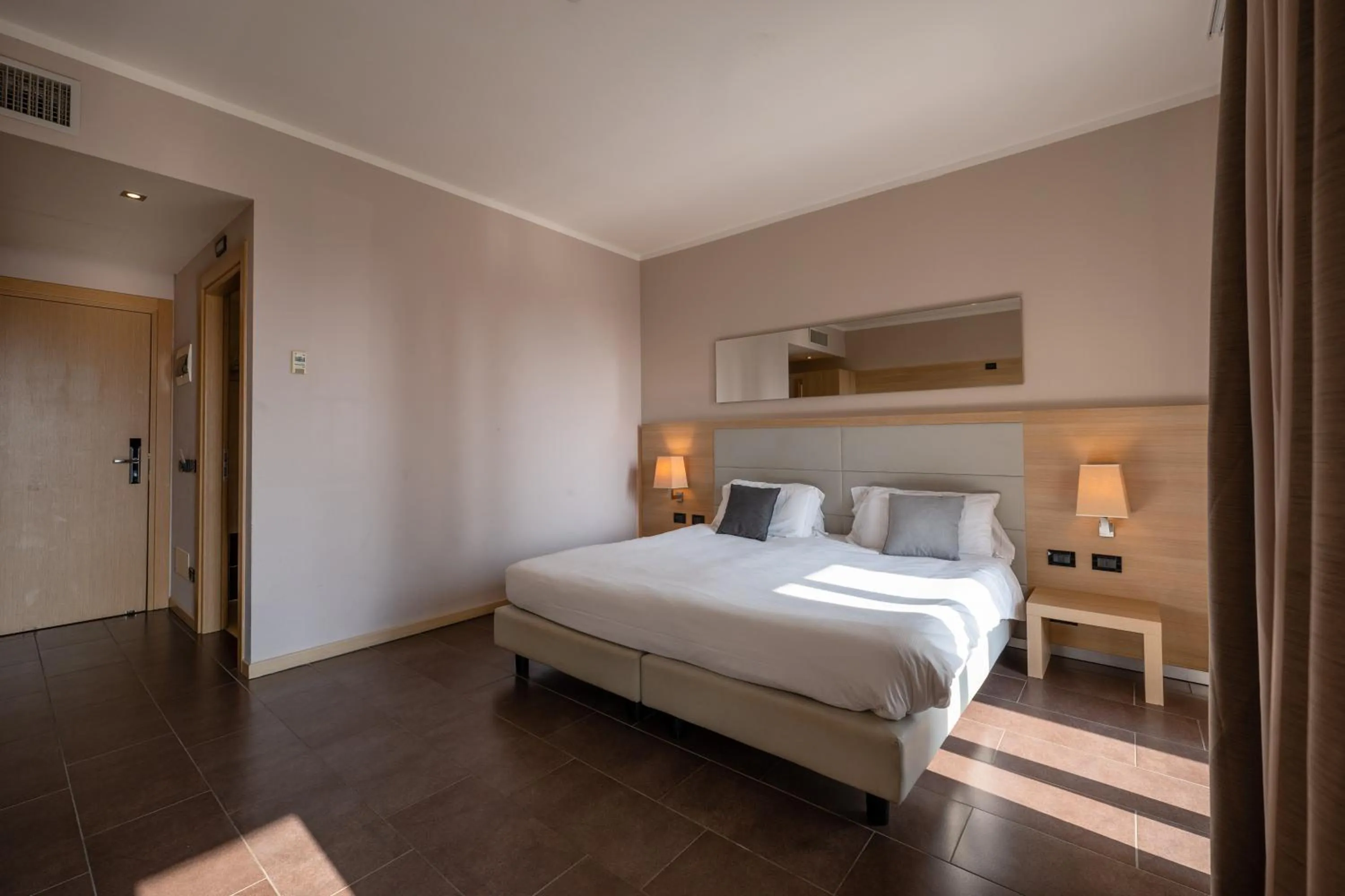 Bed in Villa Luisa Resort & Luxury Apartments