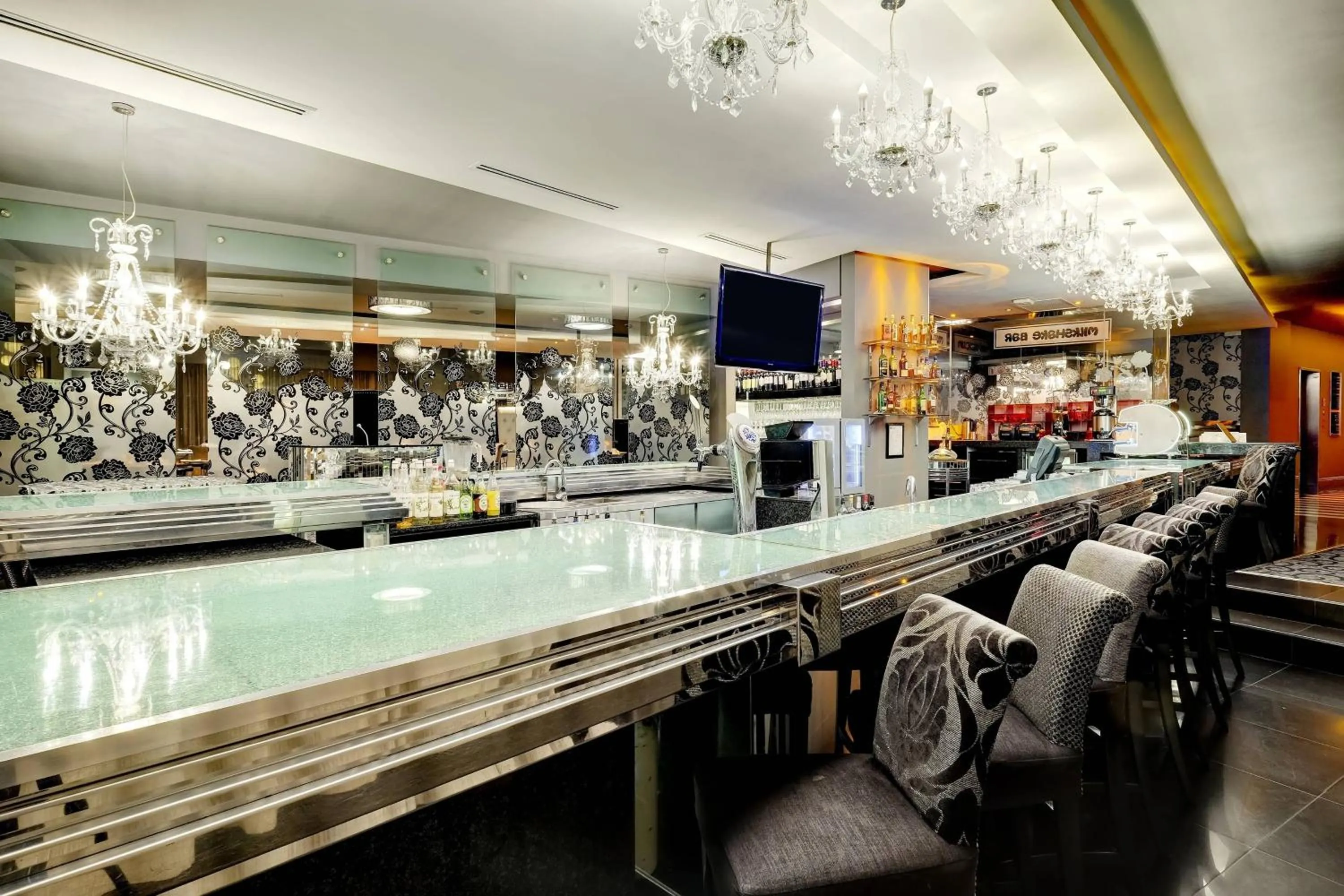 Lounge or bar in Protea Hotel Fire & Ice! by Marriott Johannesburg Melrose Arch