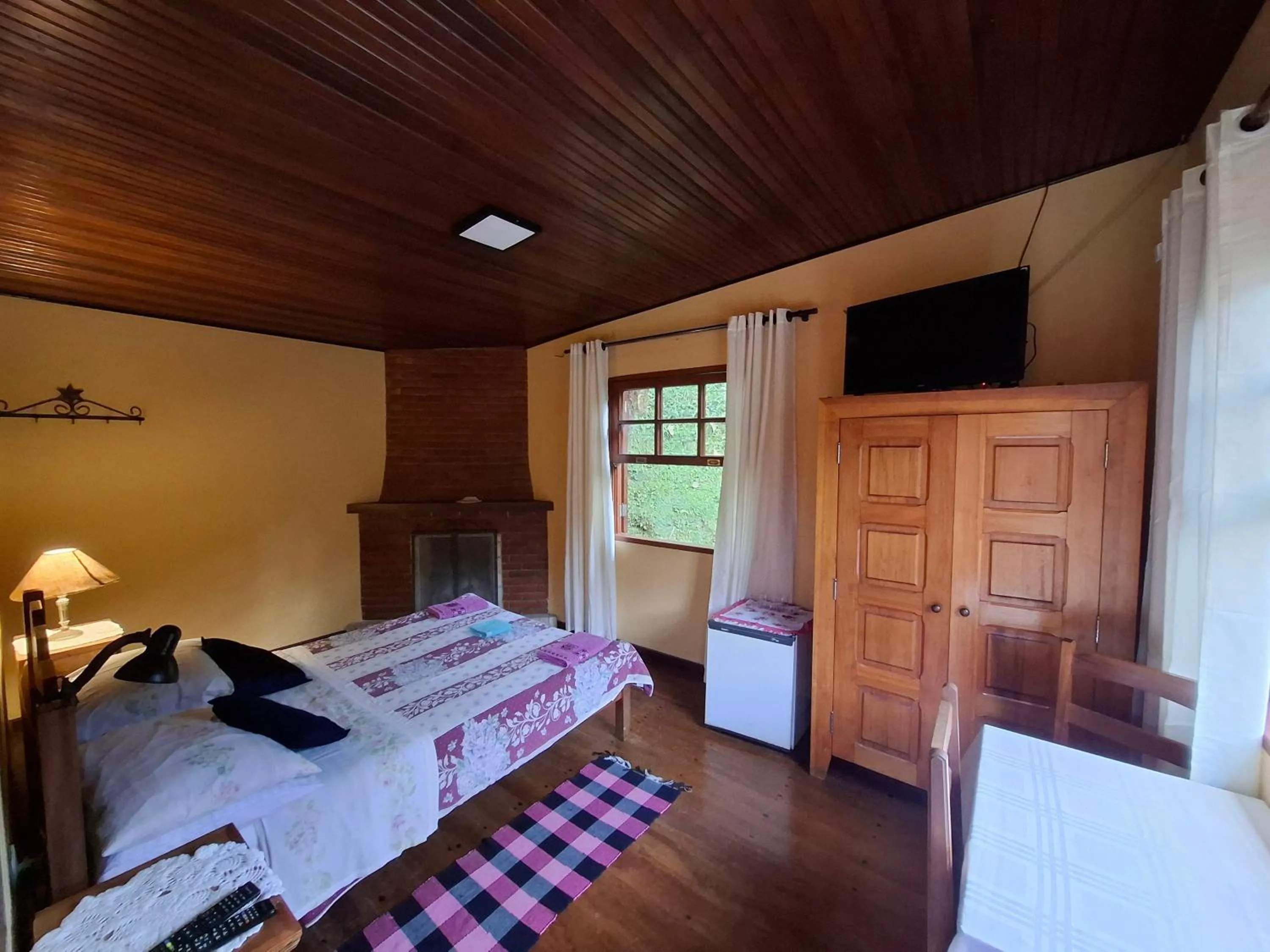 Bed in Pousada Pedra da Gávea