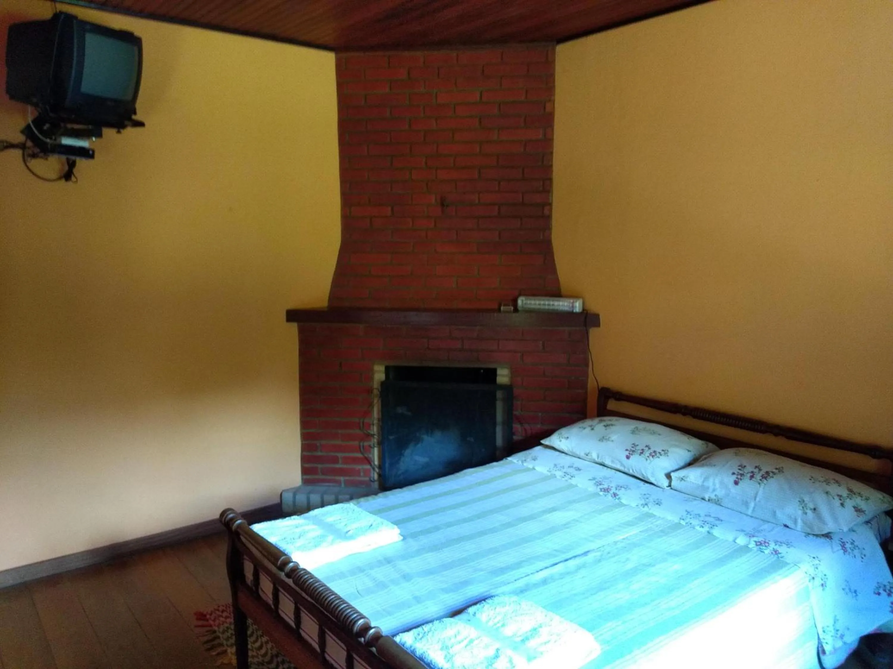 Bed in Pousada Pedra da Gávea