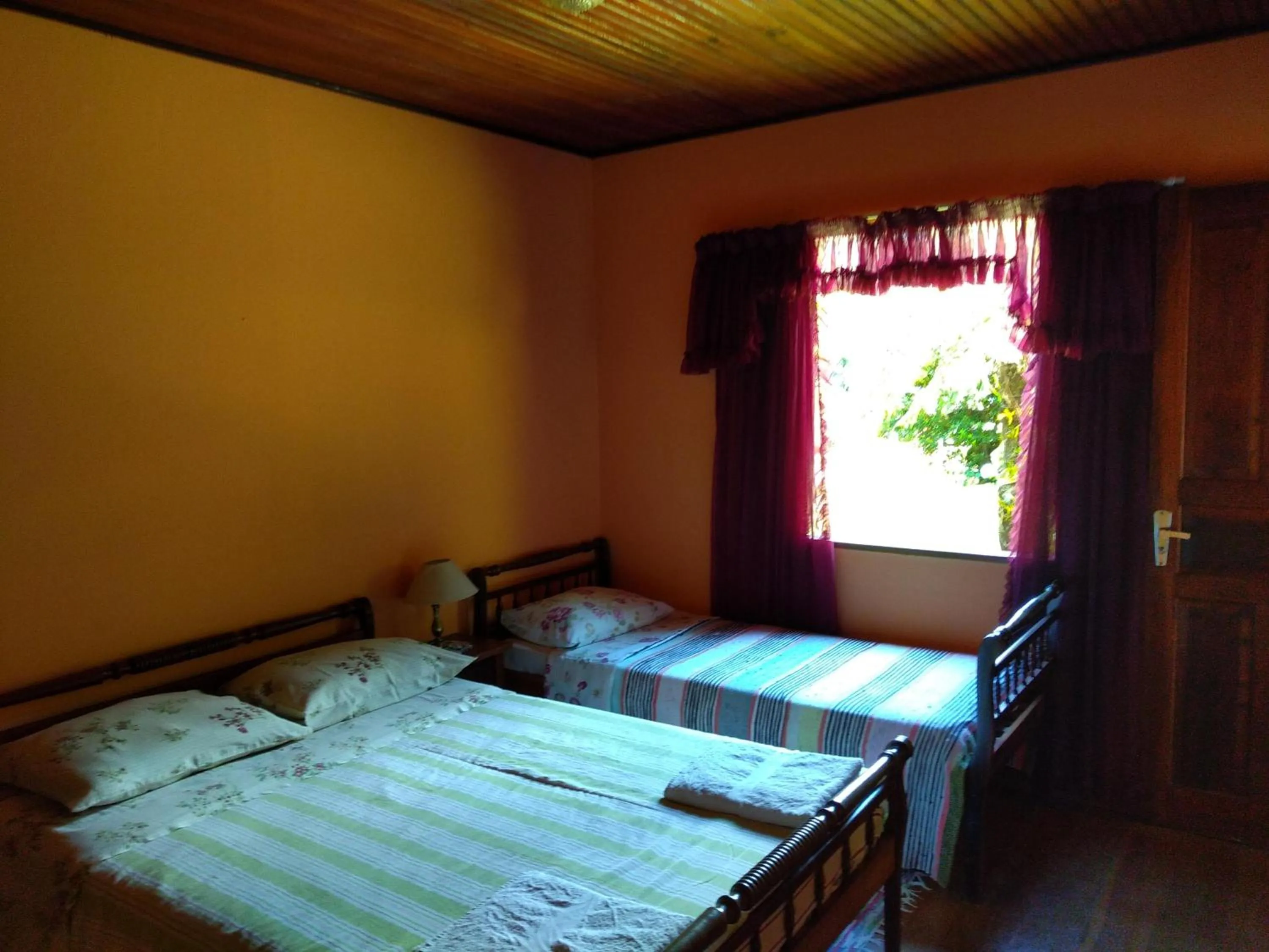 Bed in Pousada Pedra da Gávea
