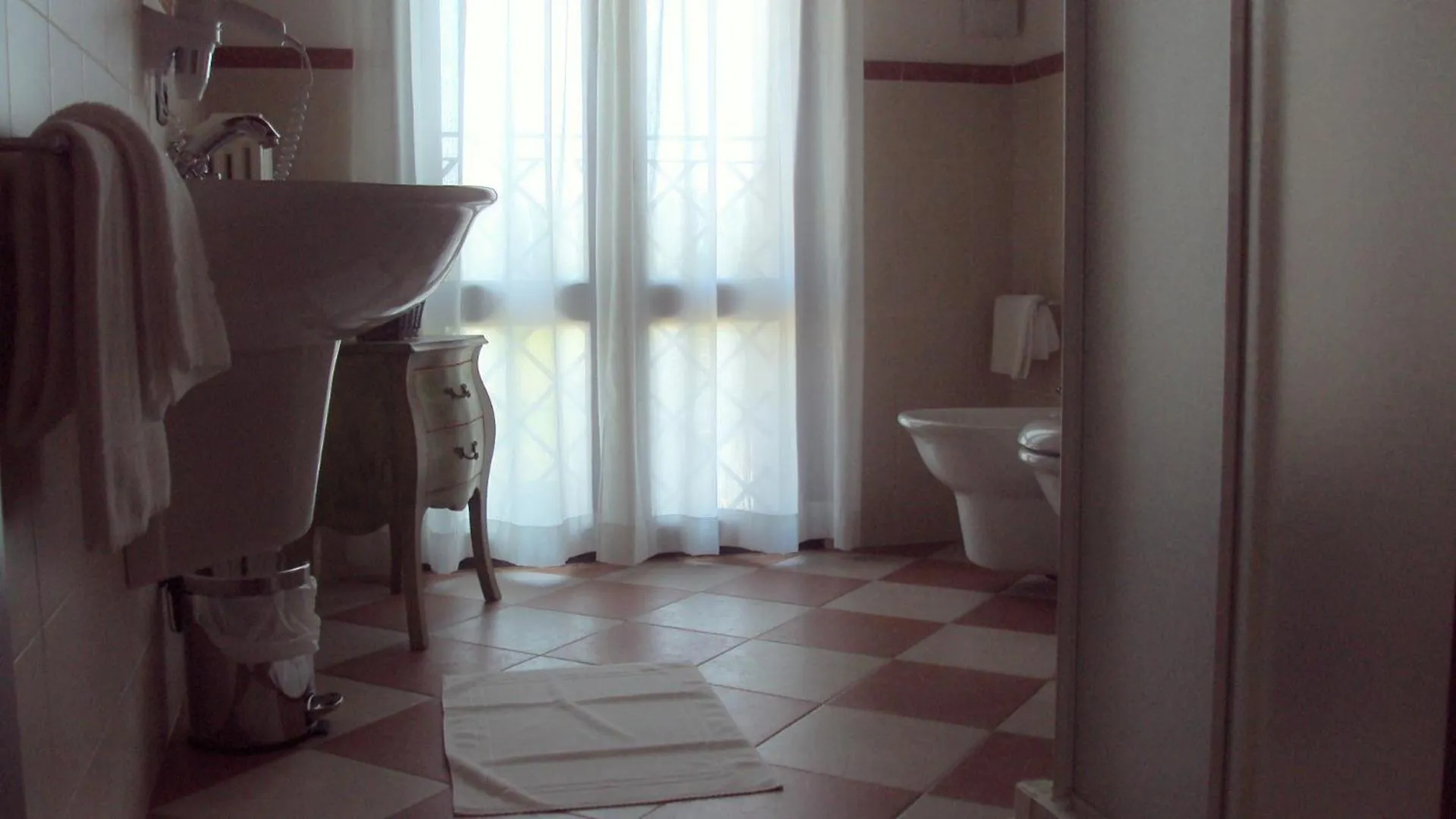 Toilet in Volivia Relais