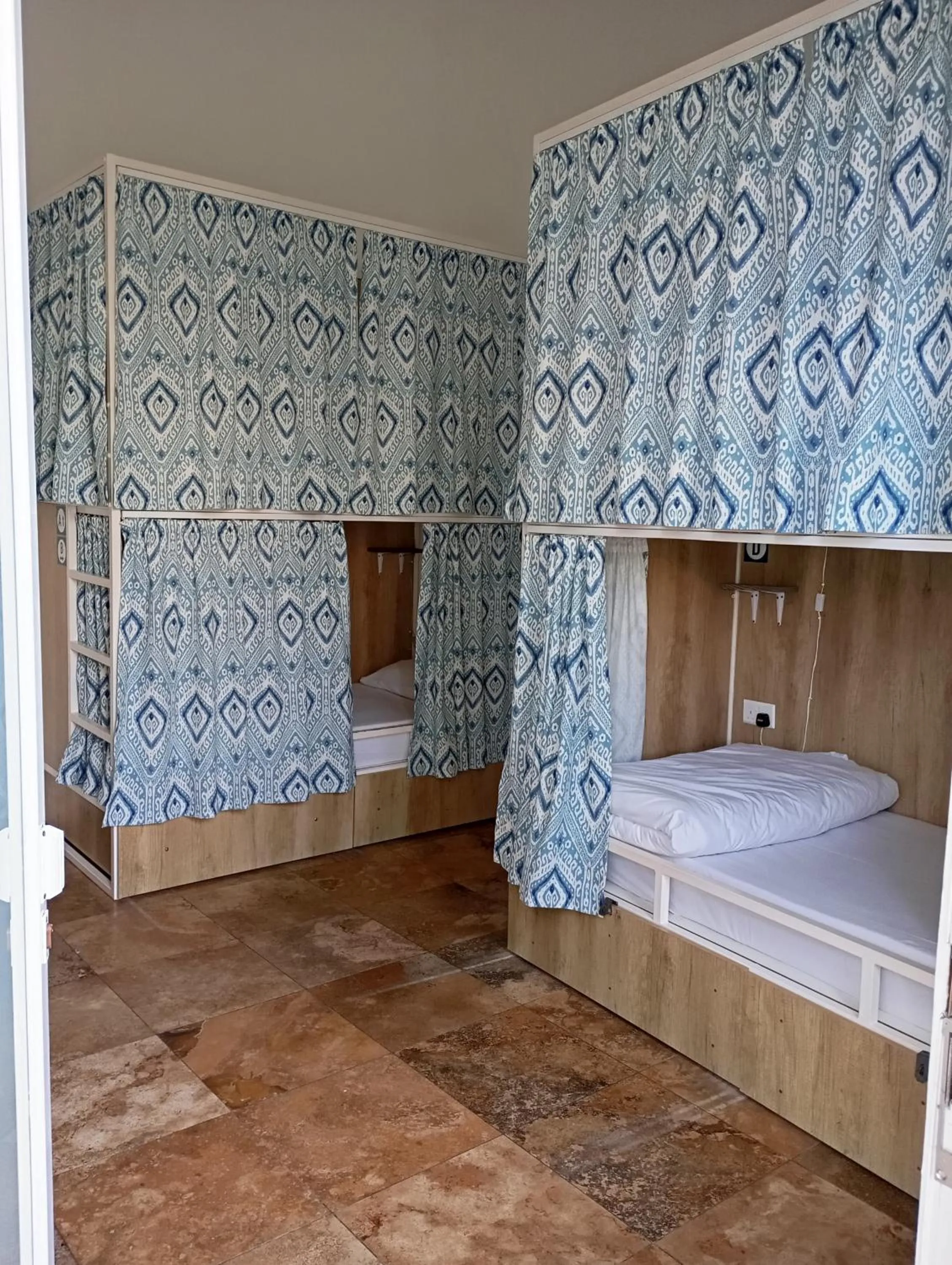 Photo of the whole room, Bed in Follow the Sun Boutique Hostel - Pool, Breakfast & Sea Views