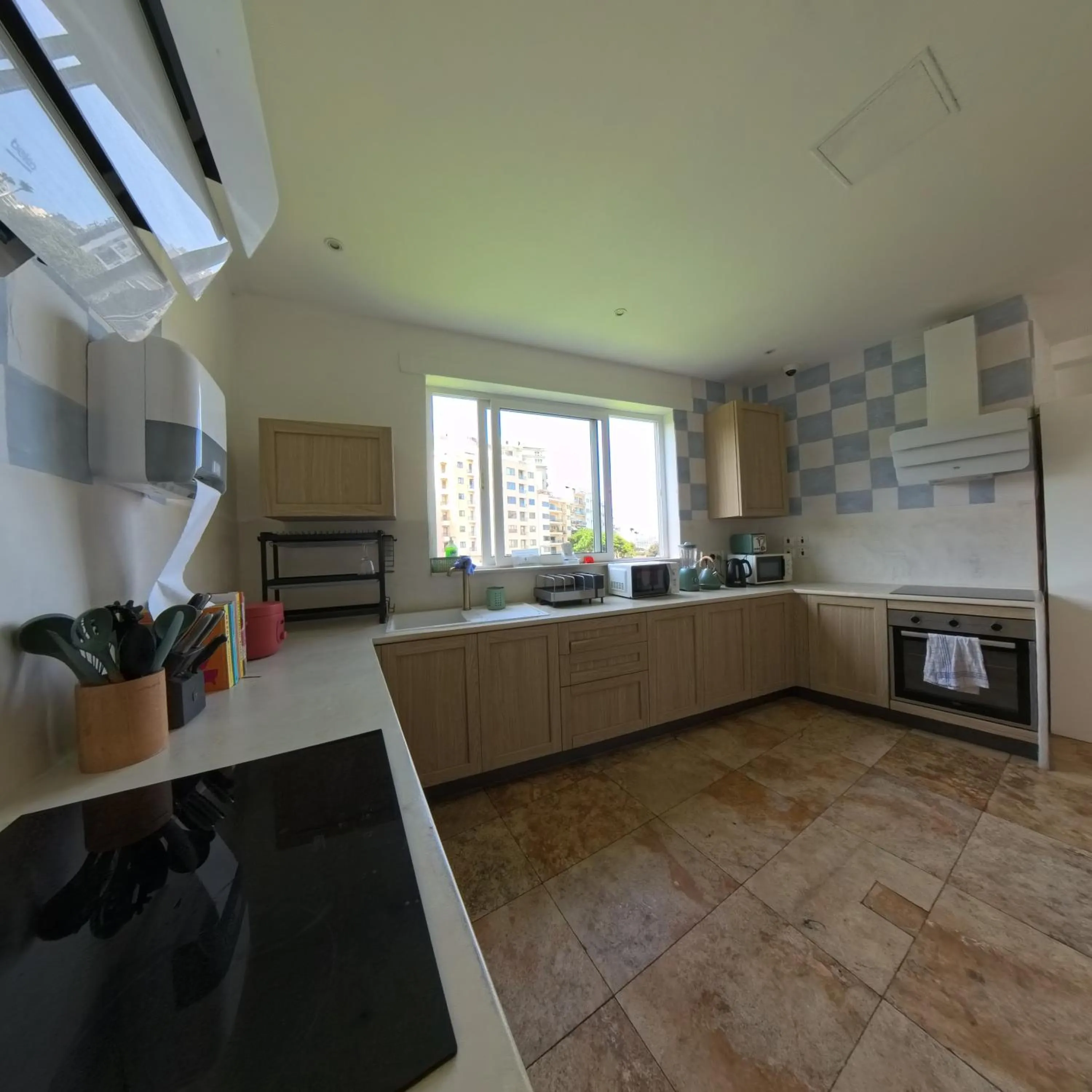 kitchen in Follow the Sun Boutique Hostel - Pool, Breakfast & Sea Views