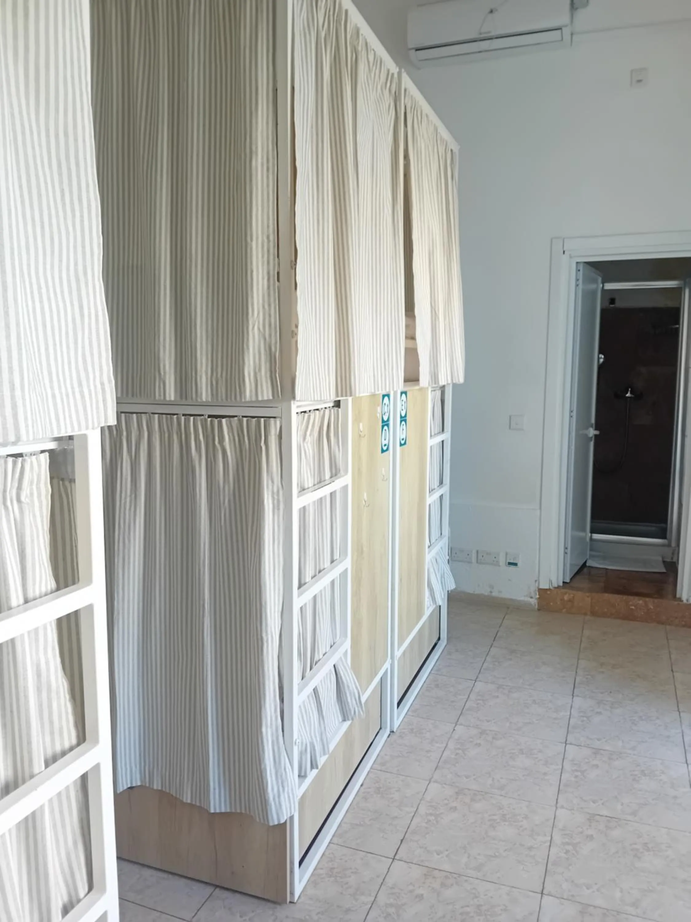 bunk bed in Follow the Sun Boutique Hostel - Pool, Breakfast & Sea Views