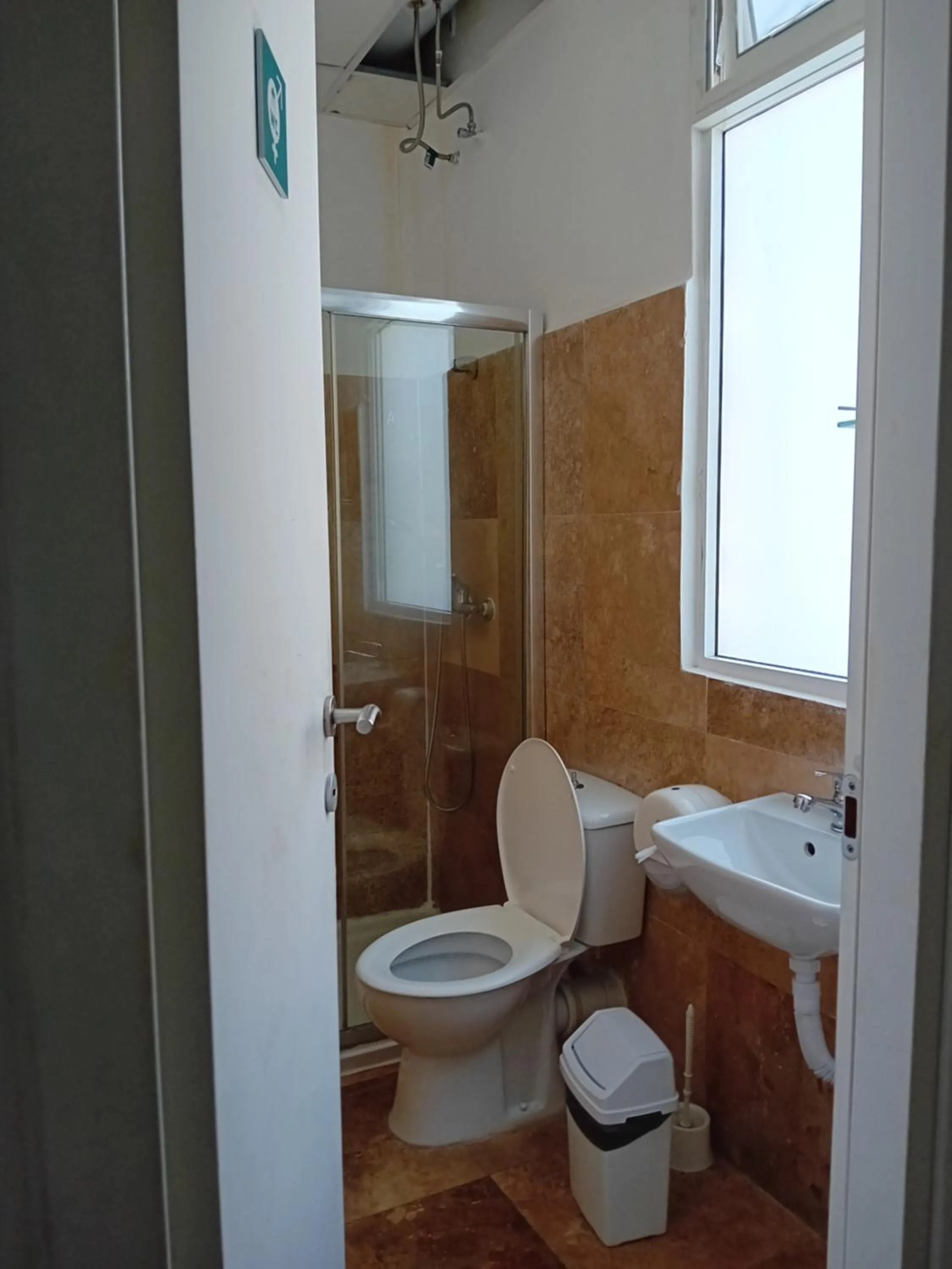 Toilet in Follow the Sun Boutique Hostel - Pool, Breakfast & Sea Views