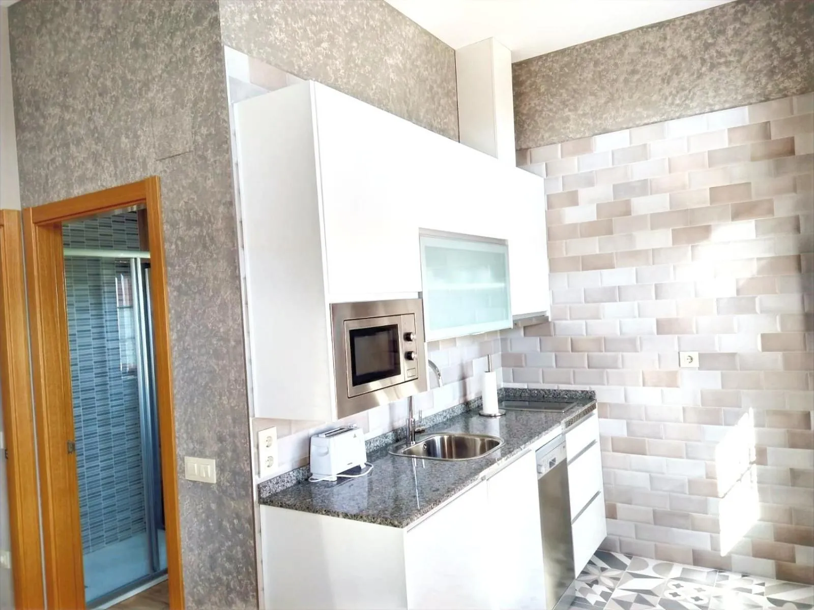 Kitchen or kitchenette in Apartamentos Navalin