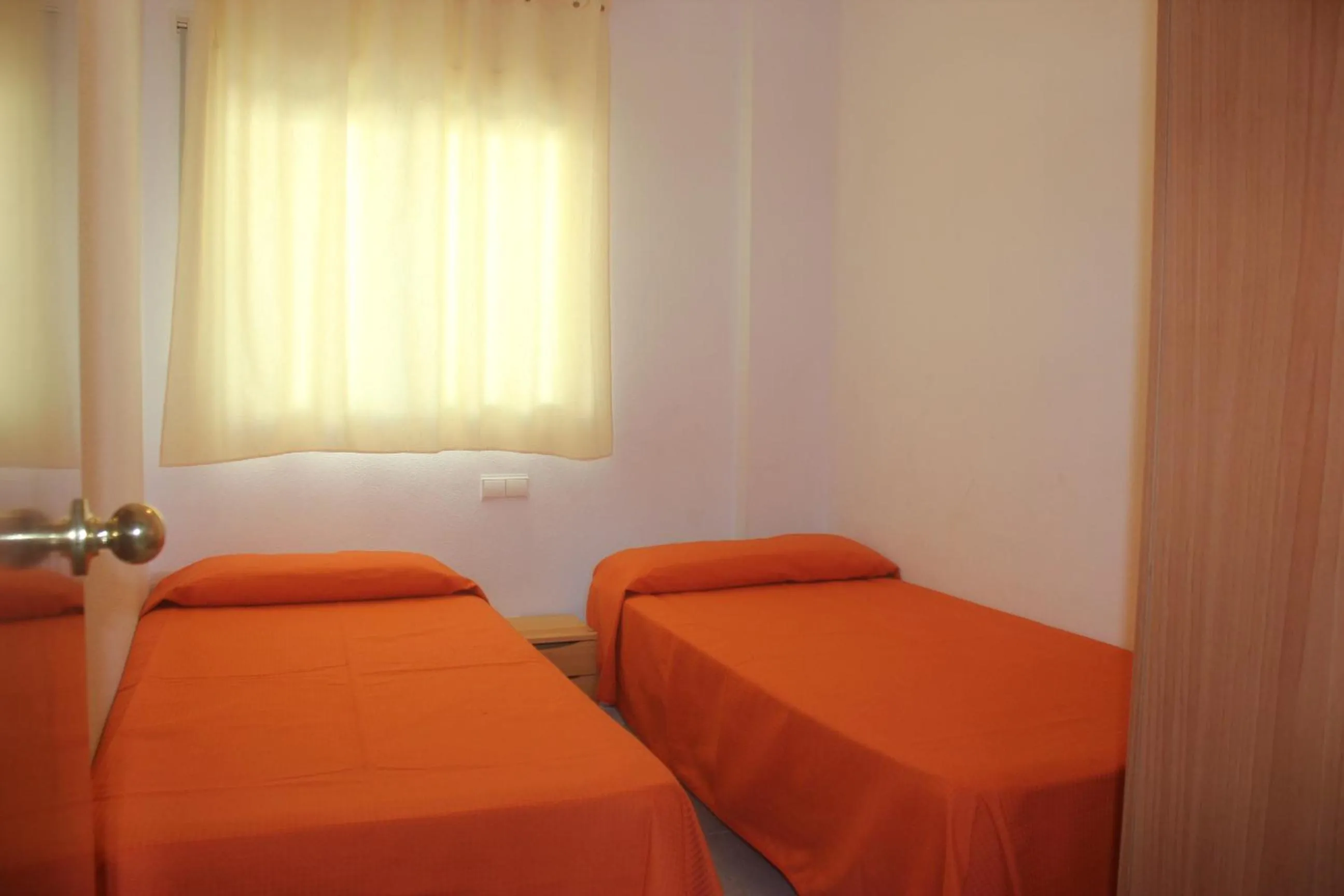 Property building, Bed in JOYAPARTMENTS Calas II