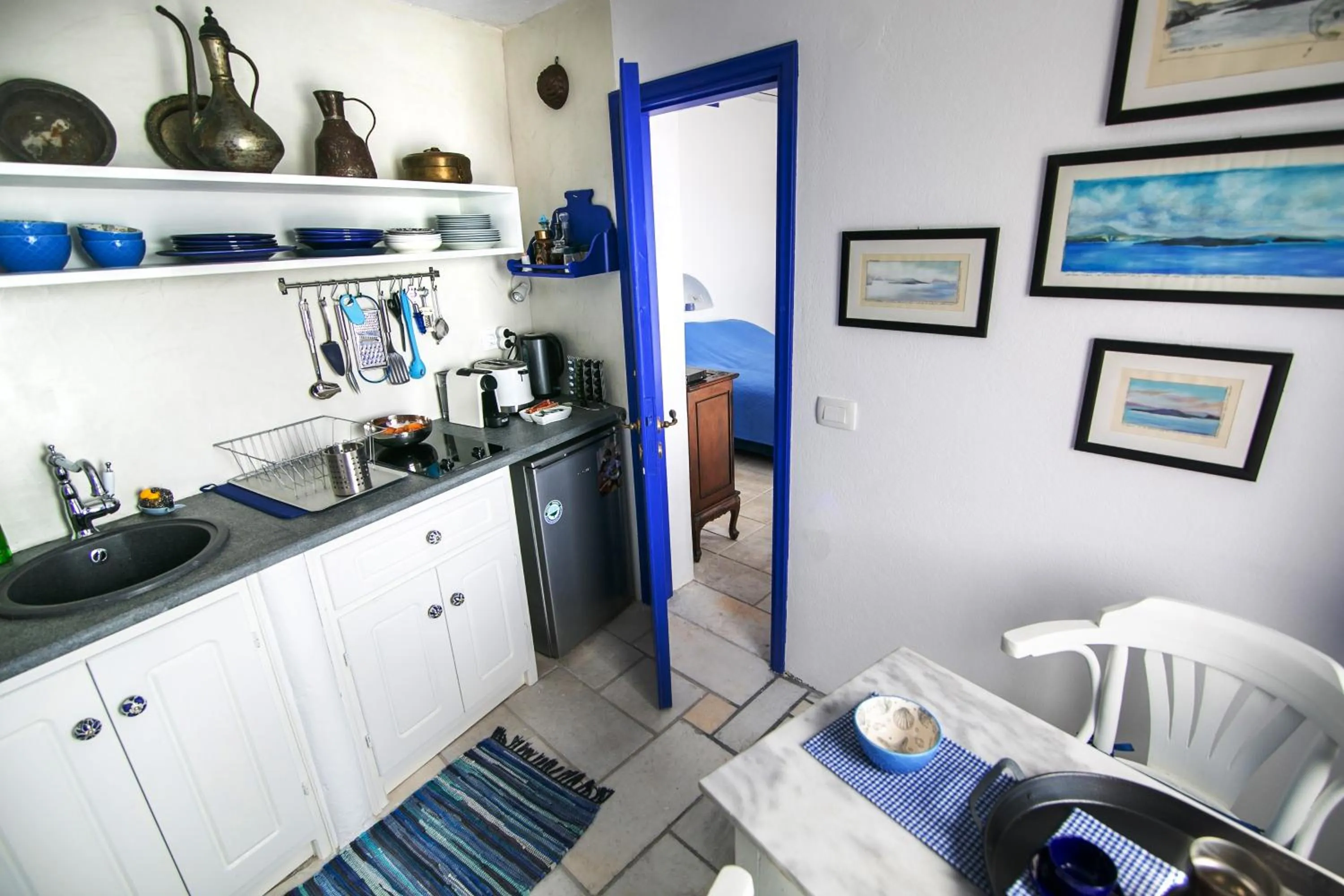 Kitchen or kitchenette in Ifestio Villas Oia