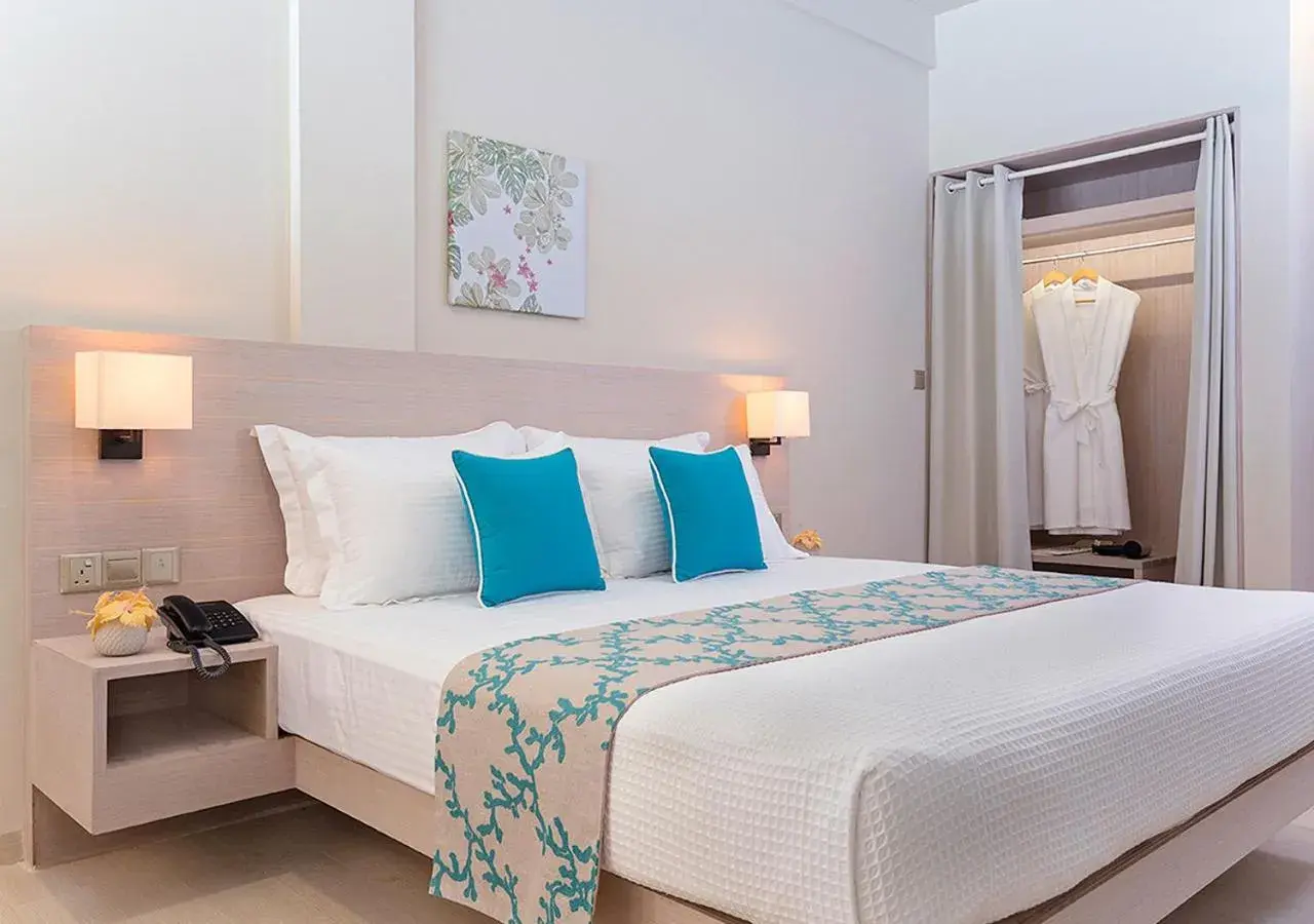 Deluxe Room with partial Ocean View in Malahini Kuda Bandos Resort Deluxe Room with partial Ocean View in Malahini Kuda Bandos Resort