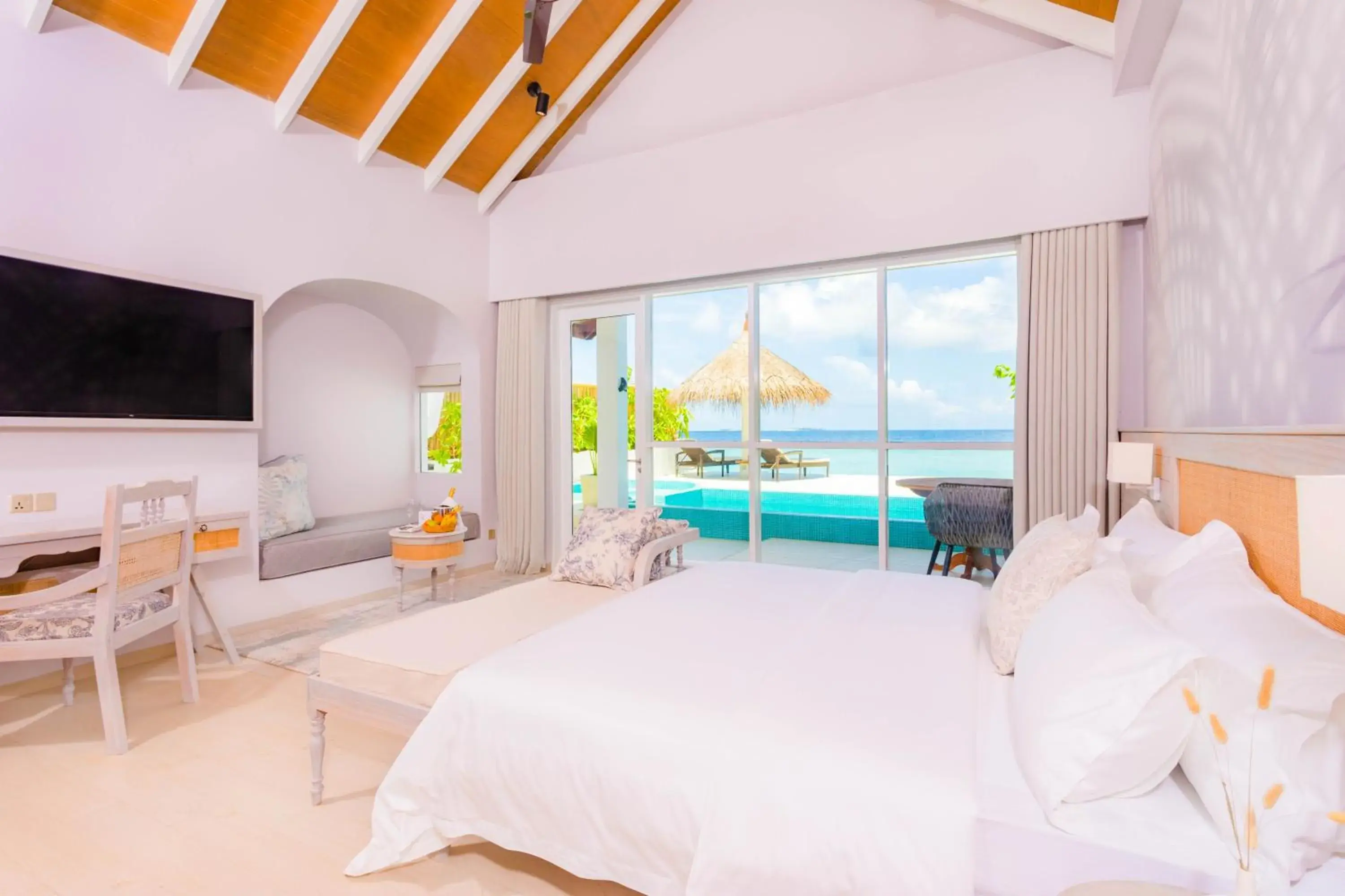 Bed in Malahini Kuda Bandos Resort Bed in Malahini Kuda Bandos Resort