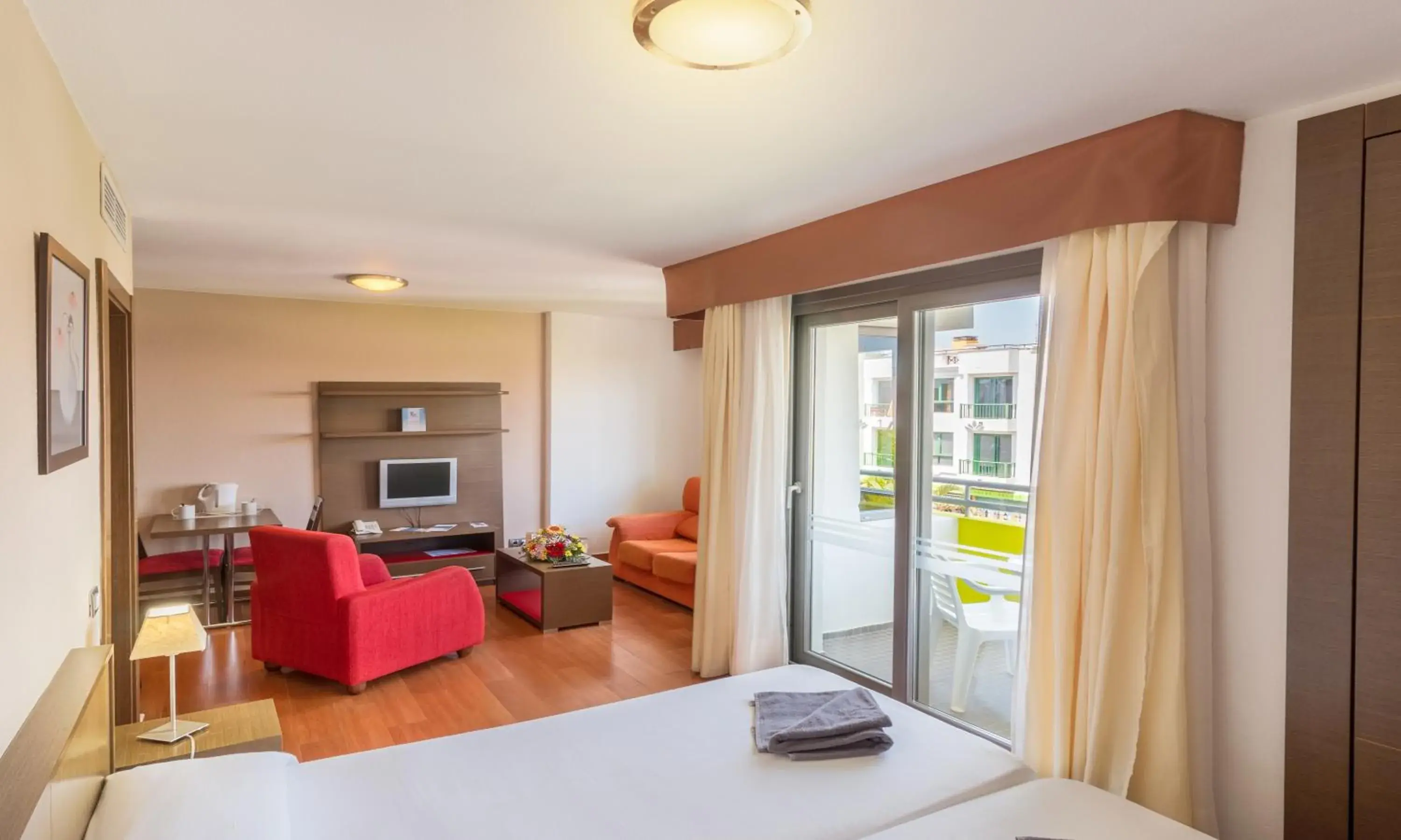 Living room, Bed in Hotel LIVVO Corralejo Beach Living room, Bed in Hotel LIVVO Corralejo Beach