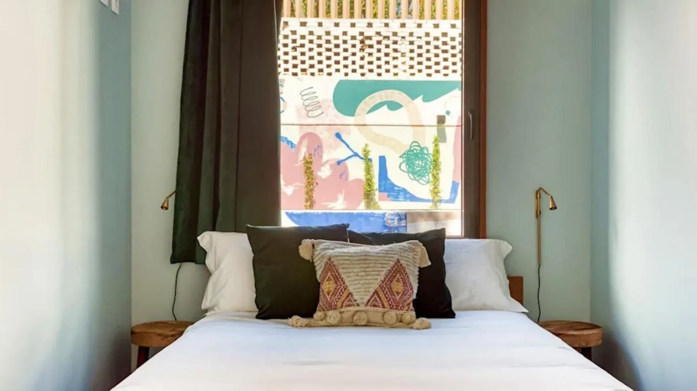 Bed in Selina Secret Garden Lisbon by IKIGAI Global Hospitality