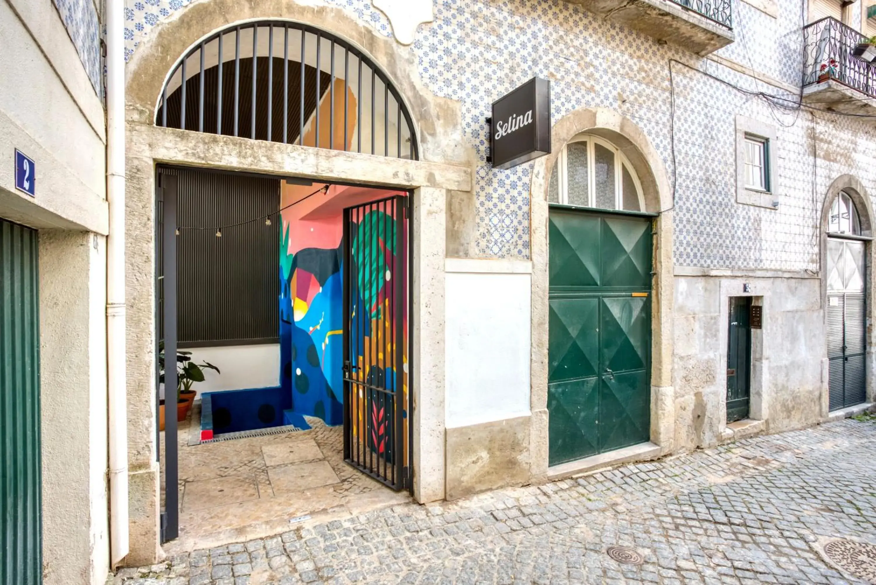 Facade/entrance in Selina Secret Garden Lisbon by IKIGAI Global Hospitality Facade/entrance in Selina Secret Garden Lisbon by IKIGAI Global Hospitality
