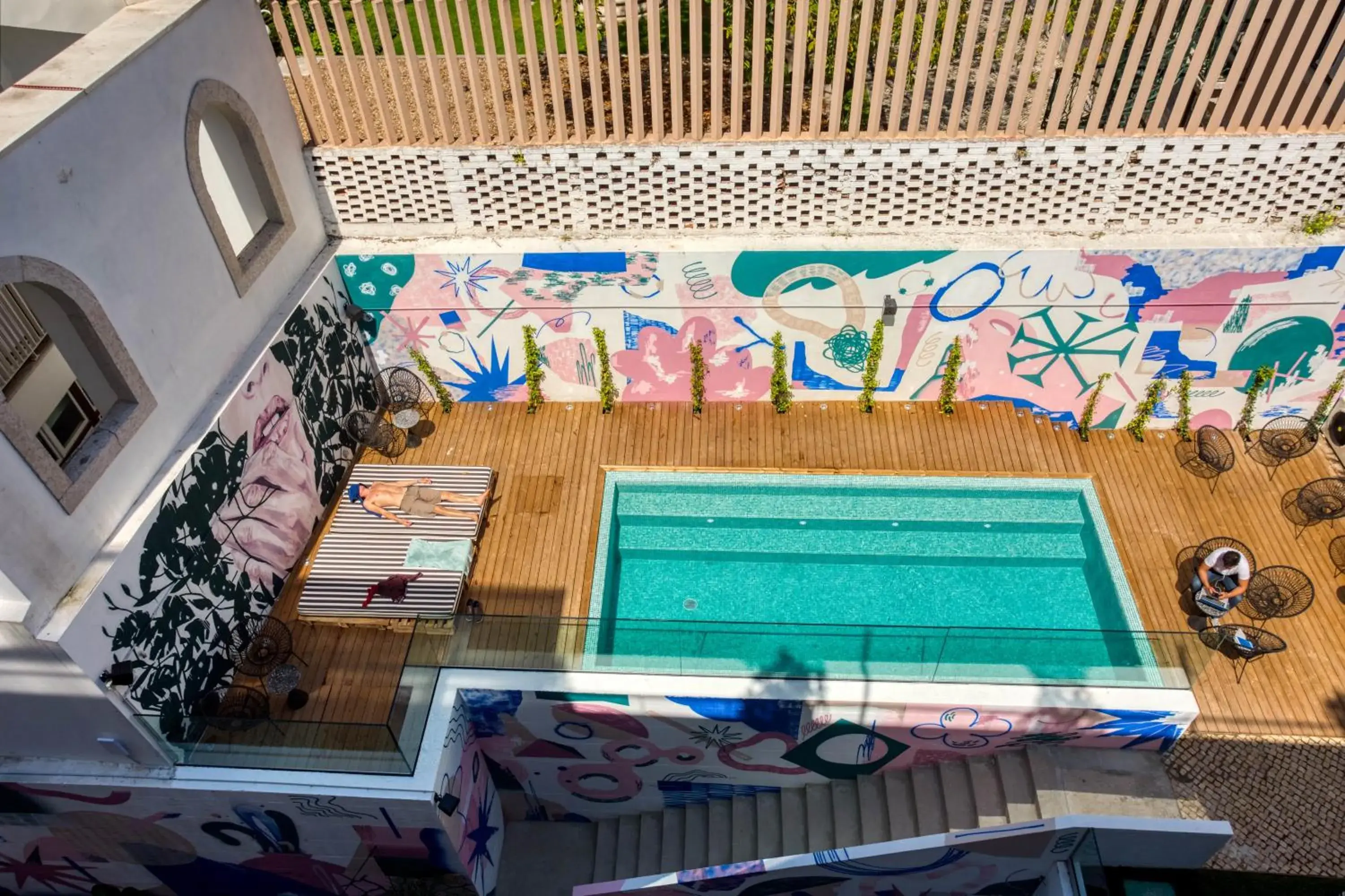 Pool view in Selina Secret Garden Lisbon by IKIGAI Global Hospitality Pool view in Selina Secret Garden Lisbon by IKIGAI Global Hospitality