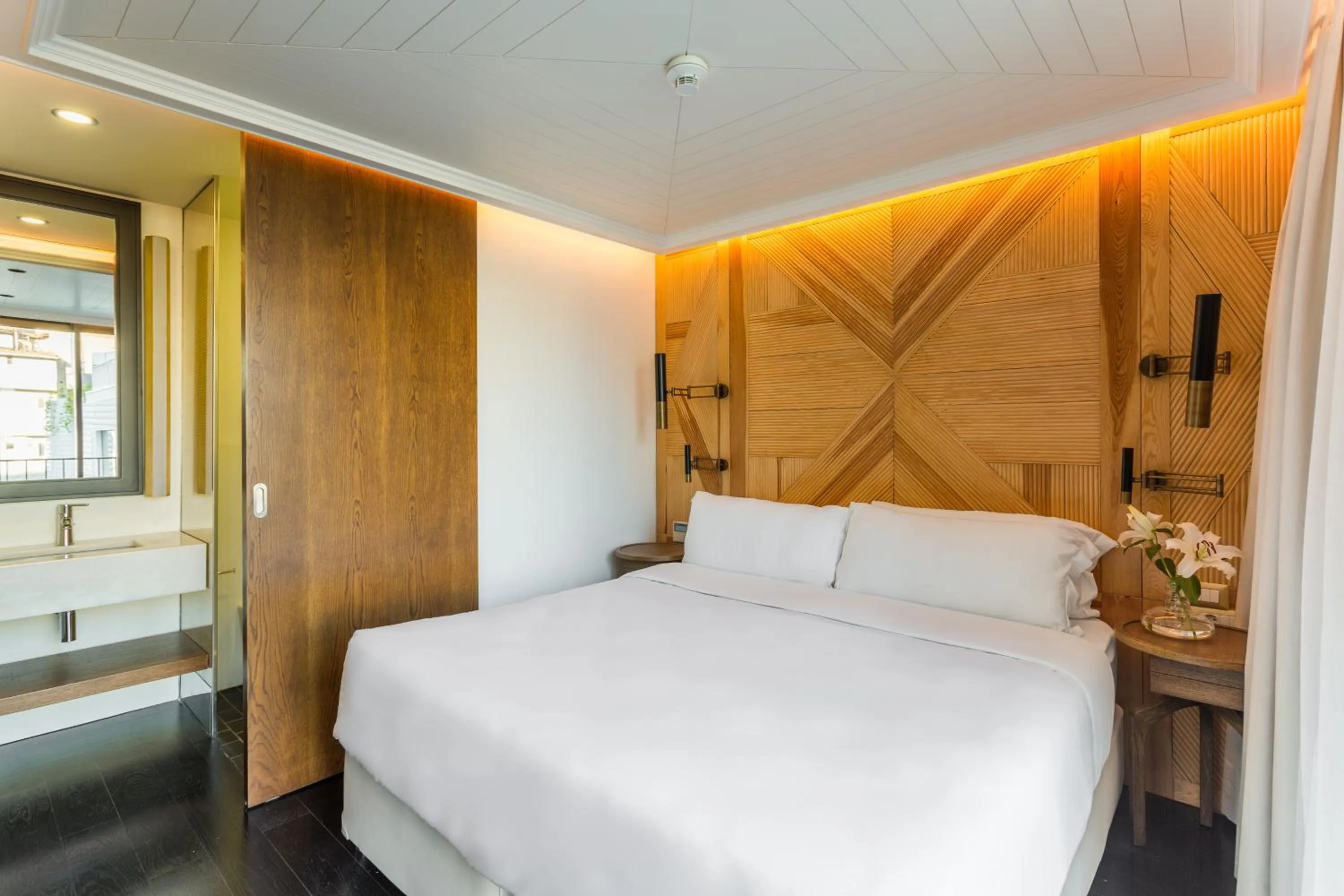 Bed in The Wings Hotels Collection