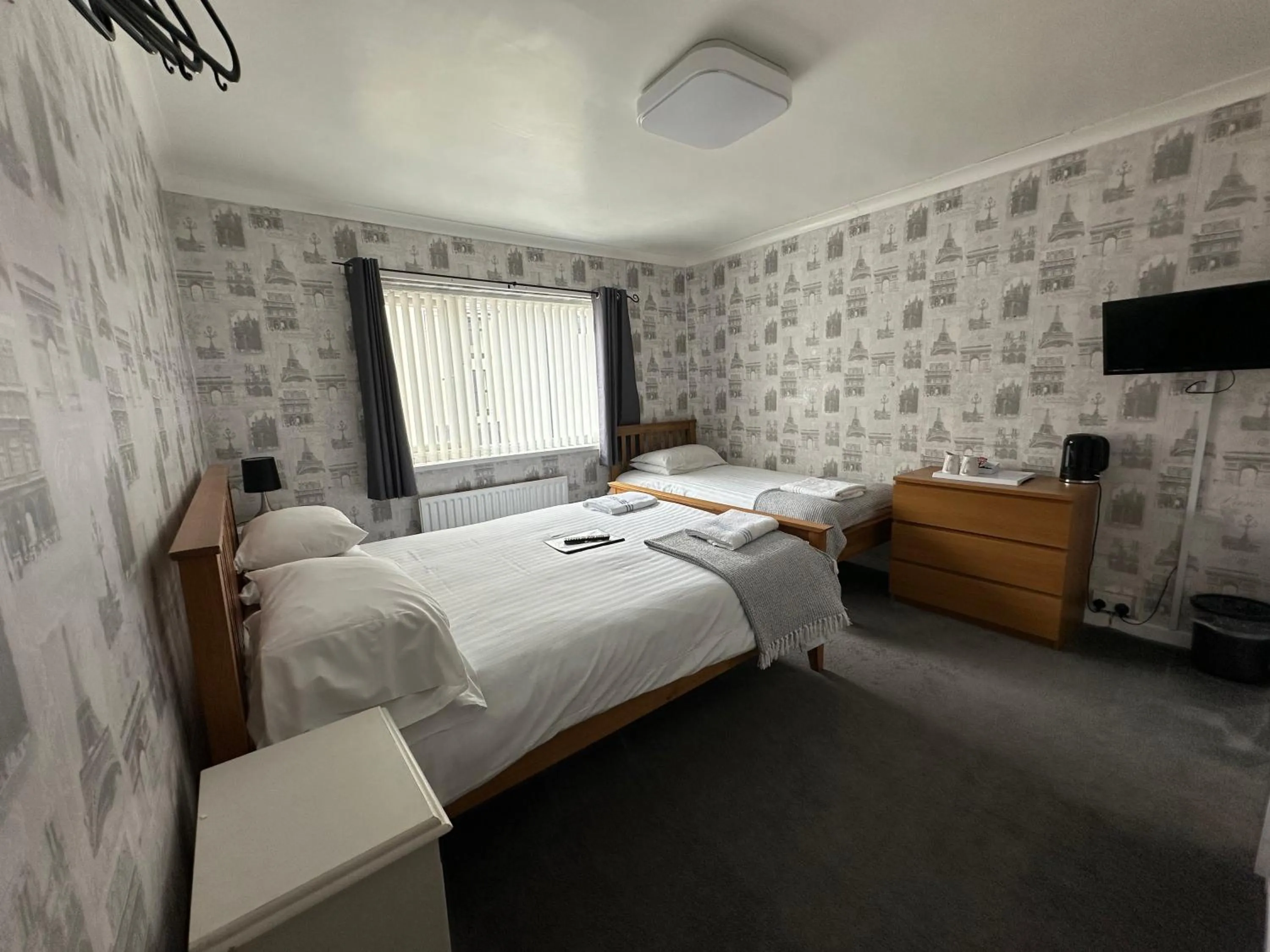 Bed in The Villa Hotel