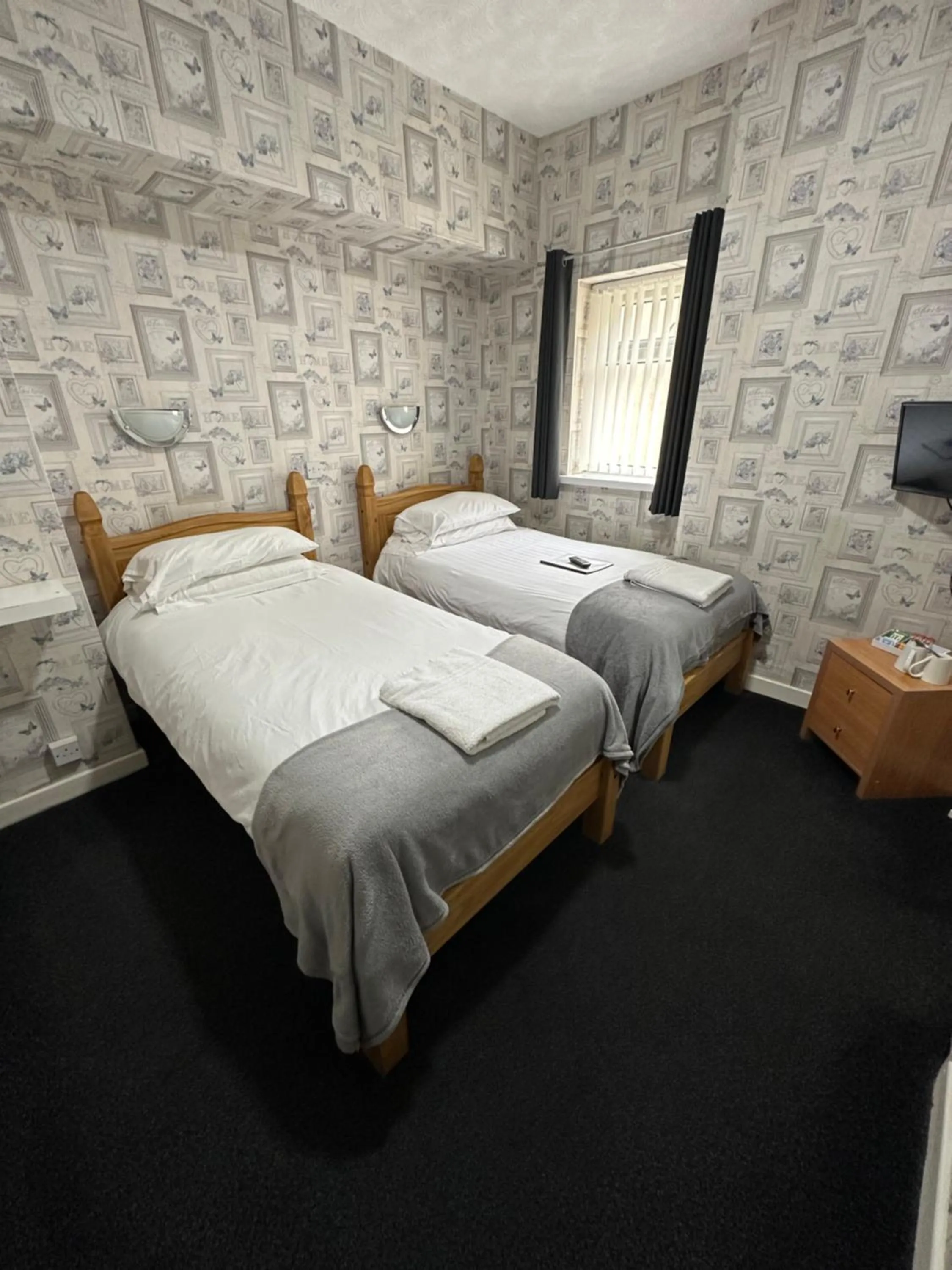 Bed in The Villa Hotel