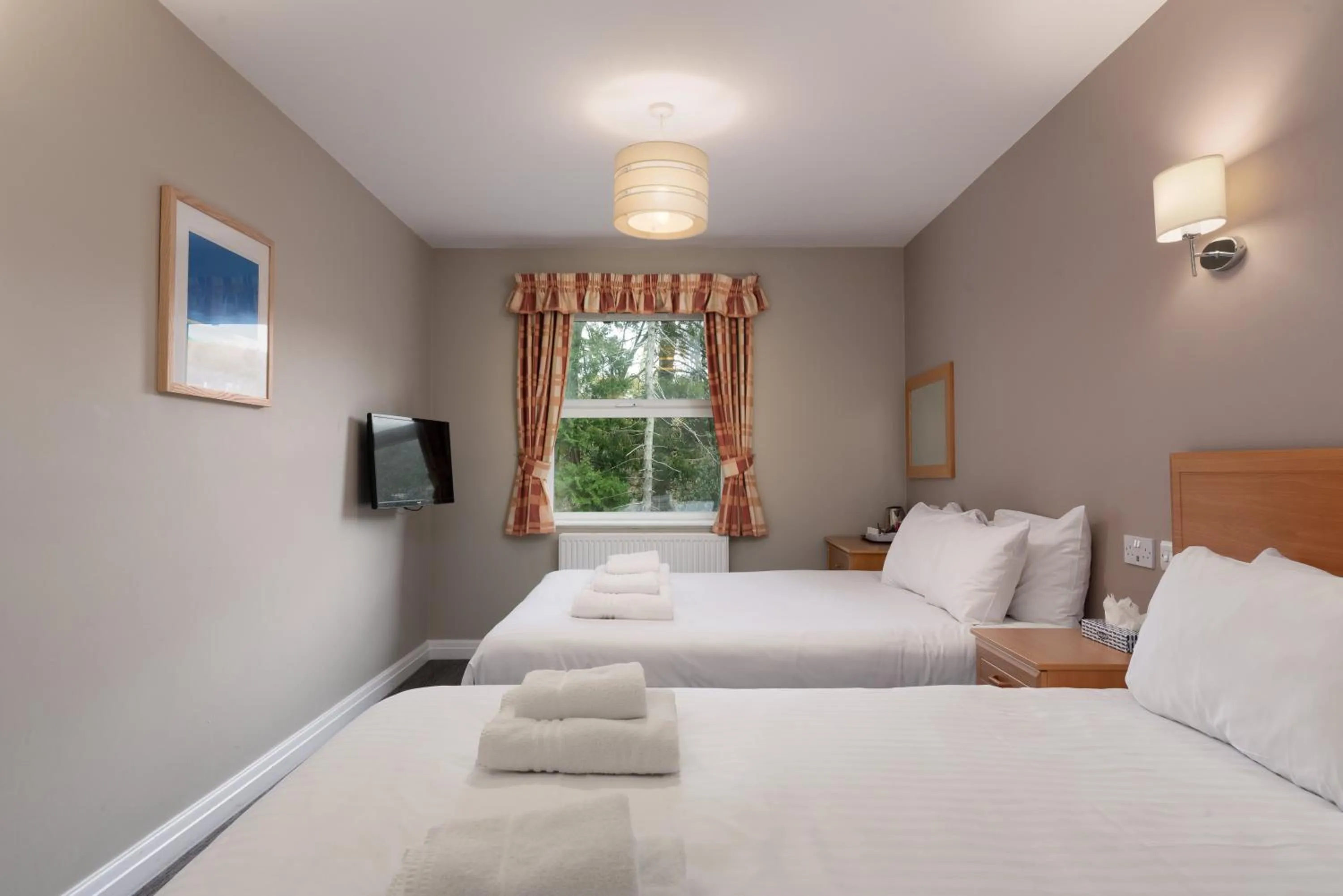 Bed in Windermere Manor Hotel