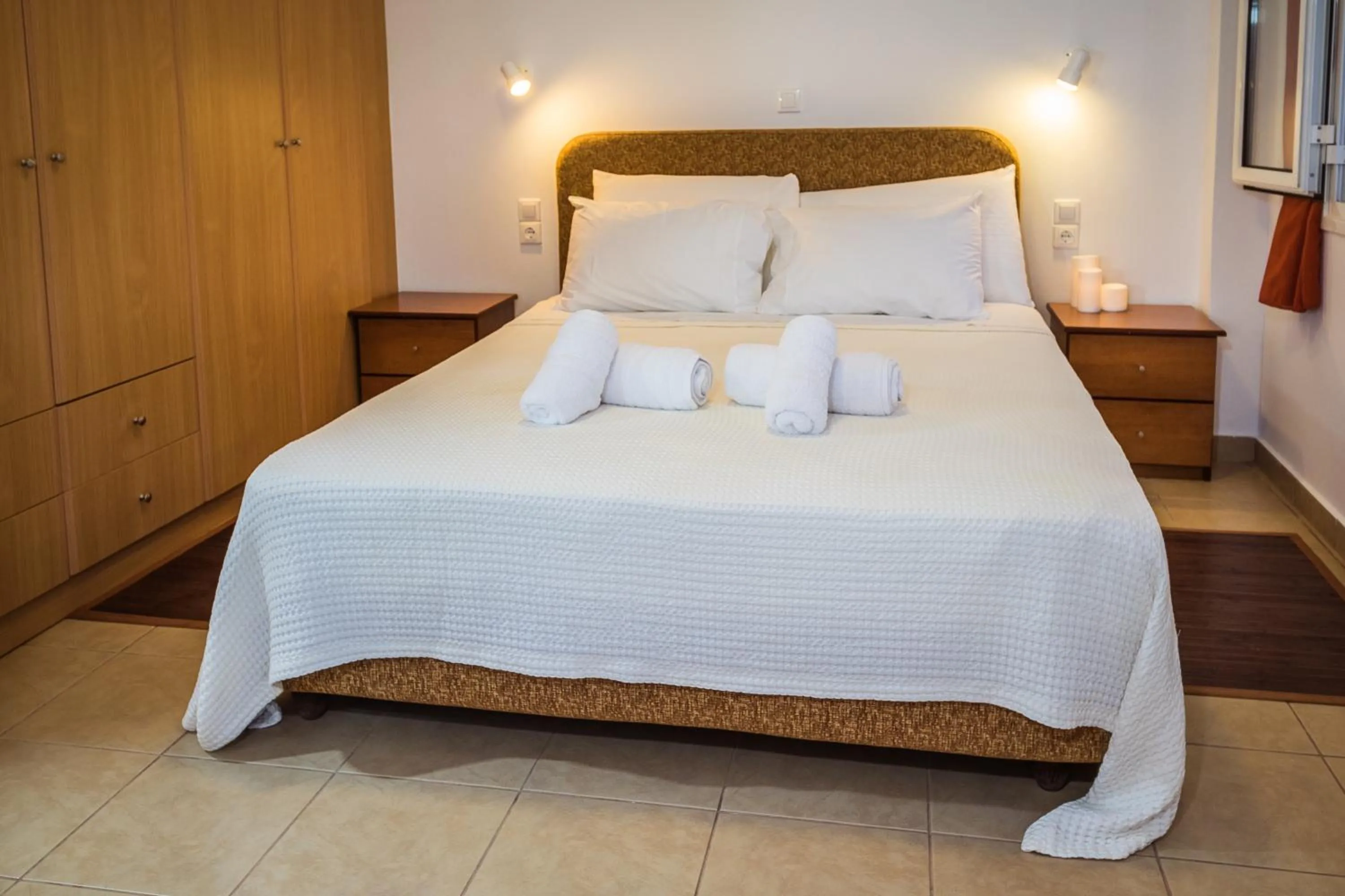 Bed in Romanos Beach Villas