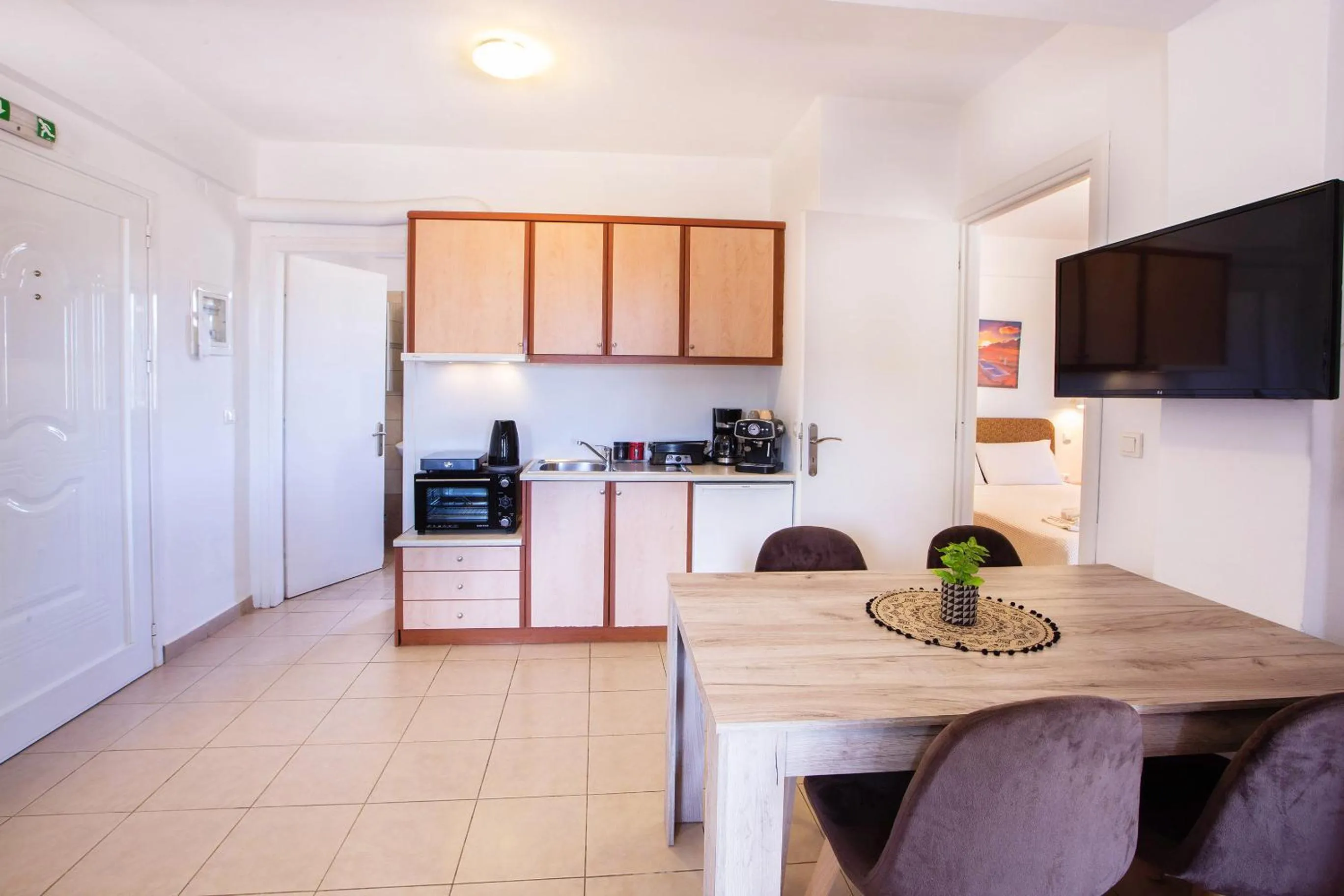 Kitchen or kitchenette in Romanos Beach Villas