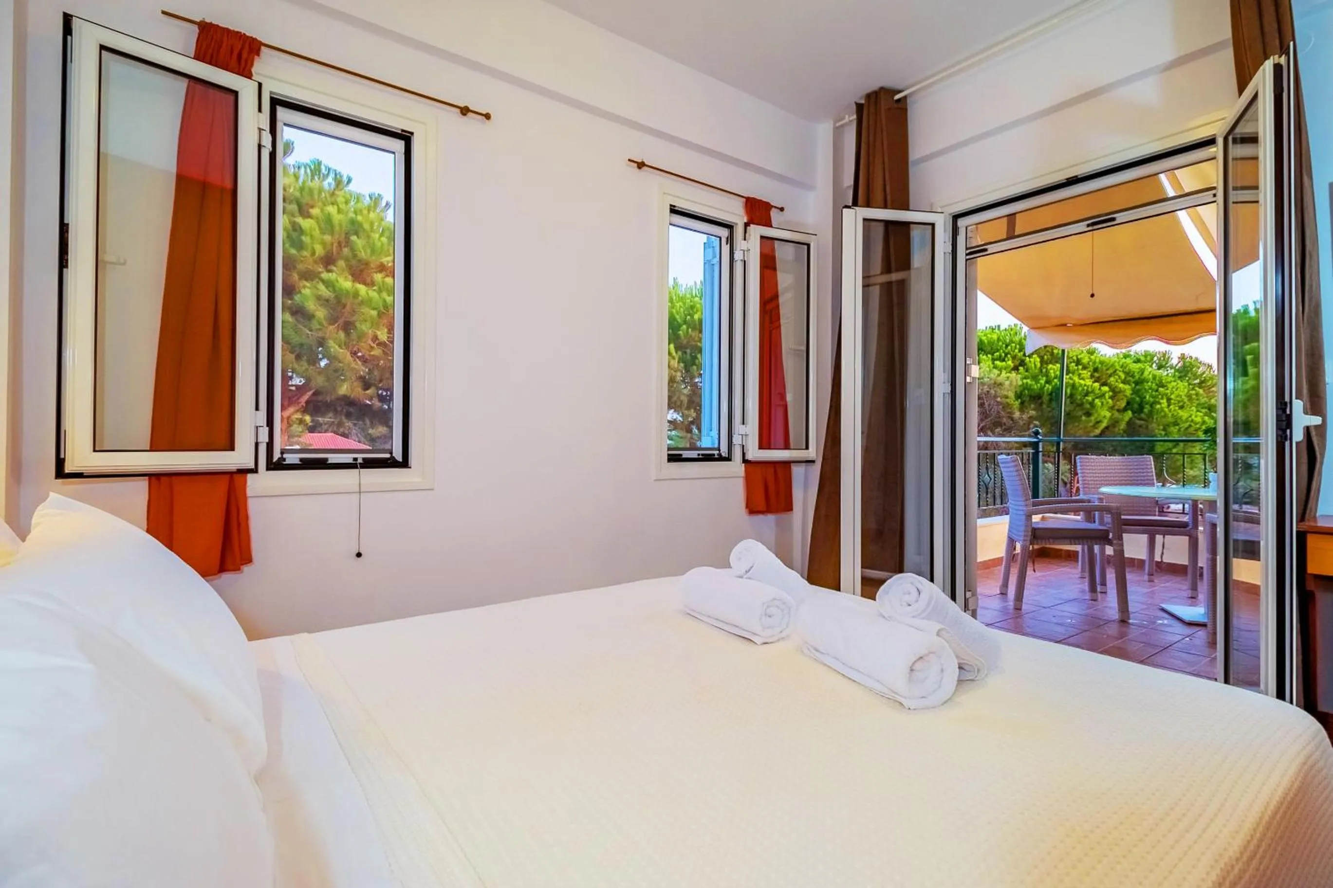 Bed in Romanos Beach Villas