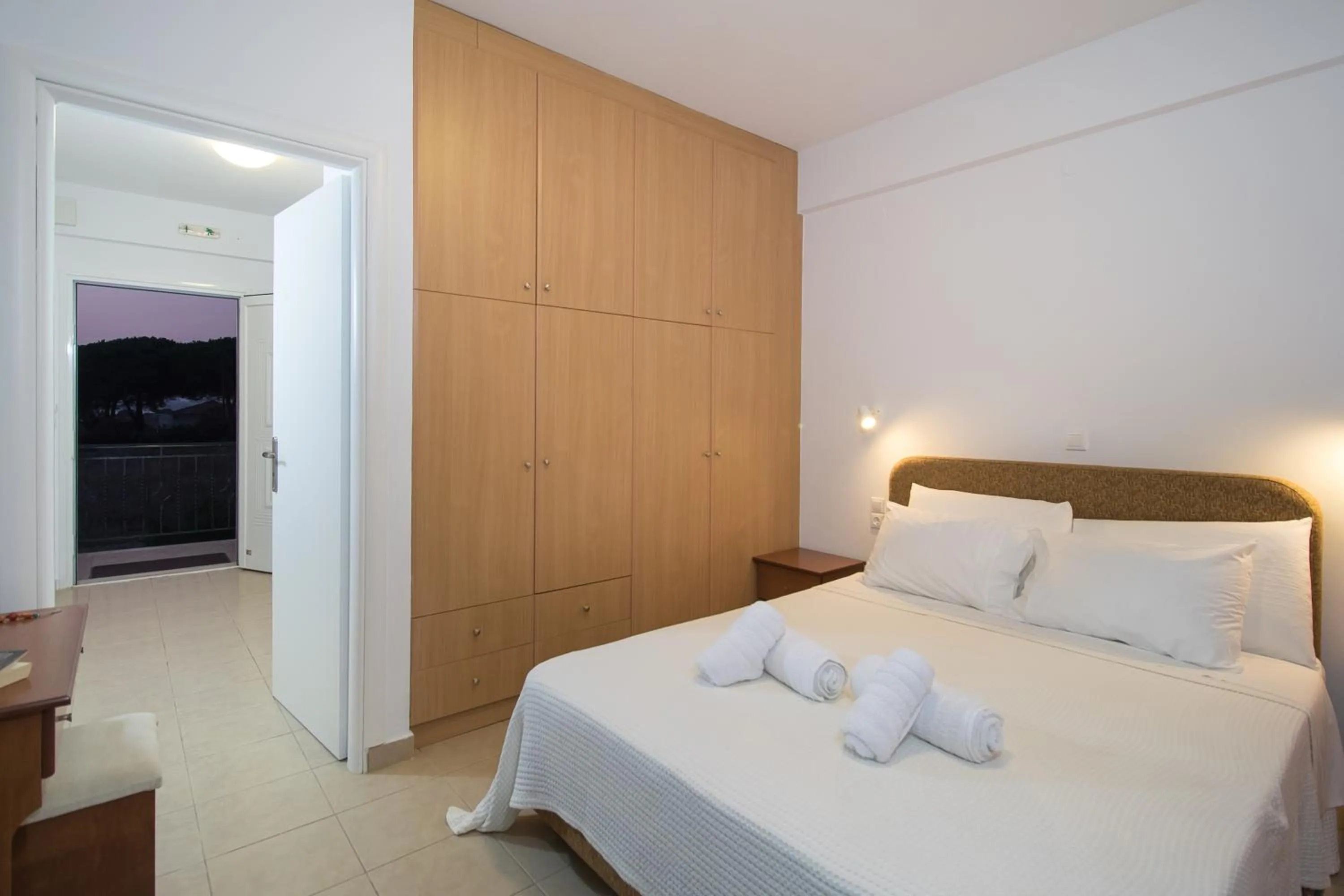 Bed in Romanos Beach Villas