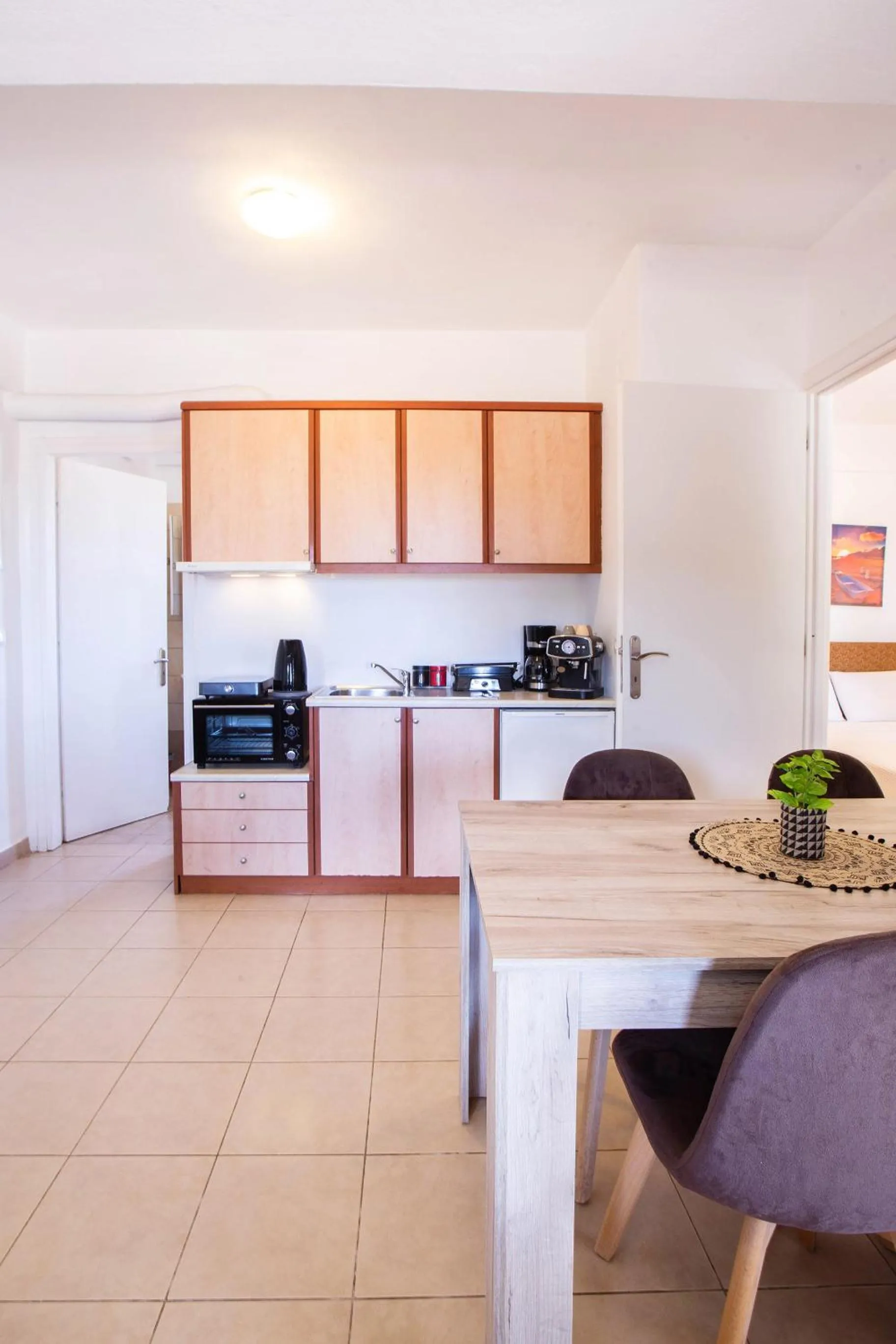 Kitchen or kitchenette in Romanos Beach Villas