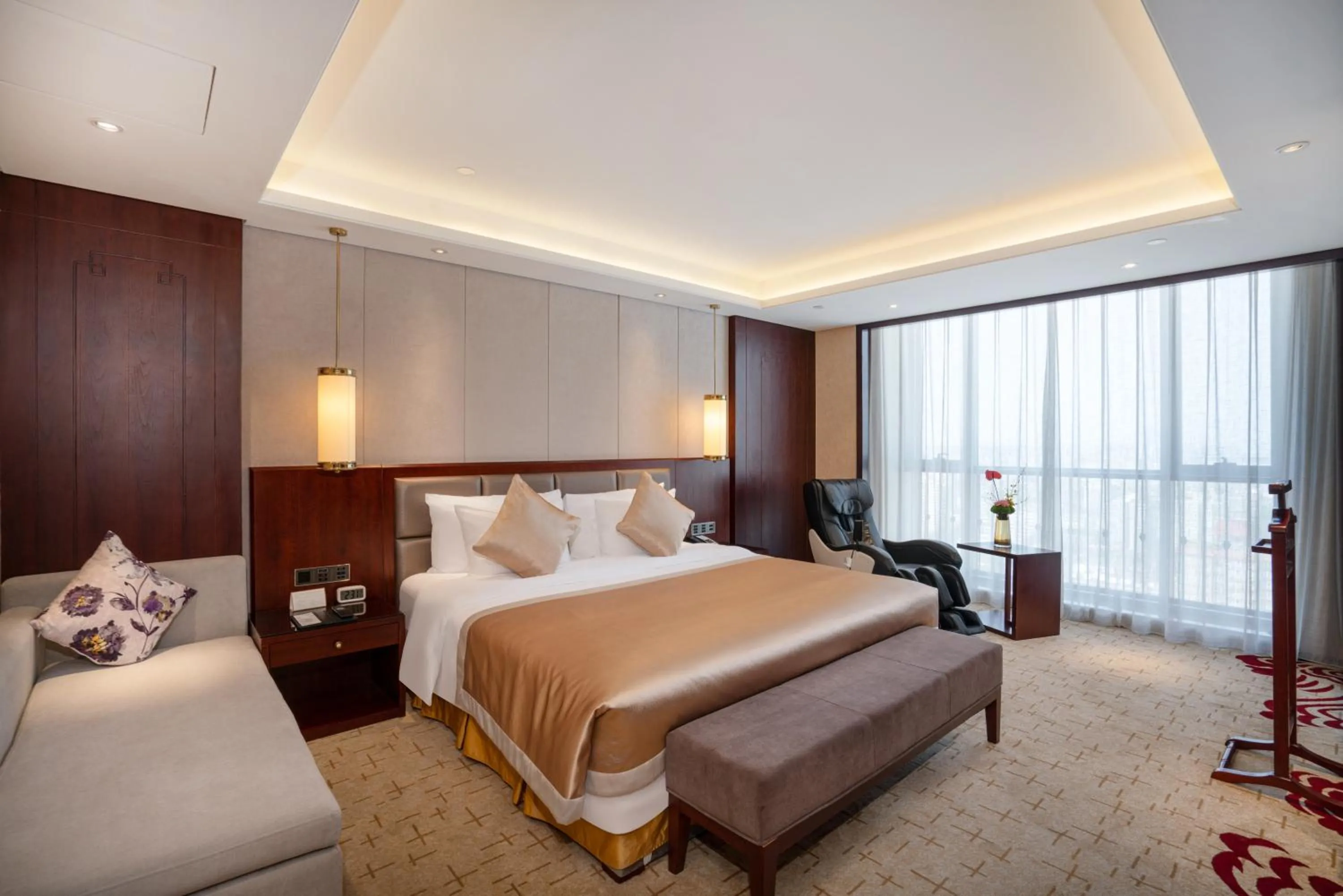 Bed in New Century Grand Hotel