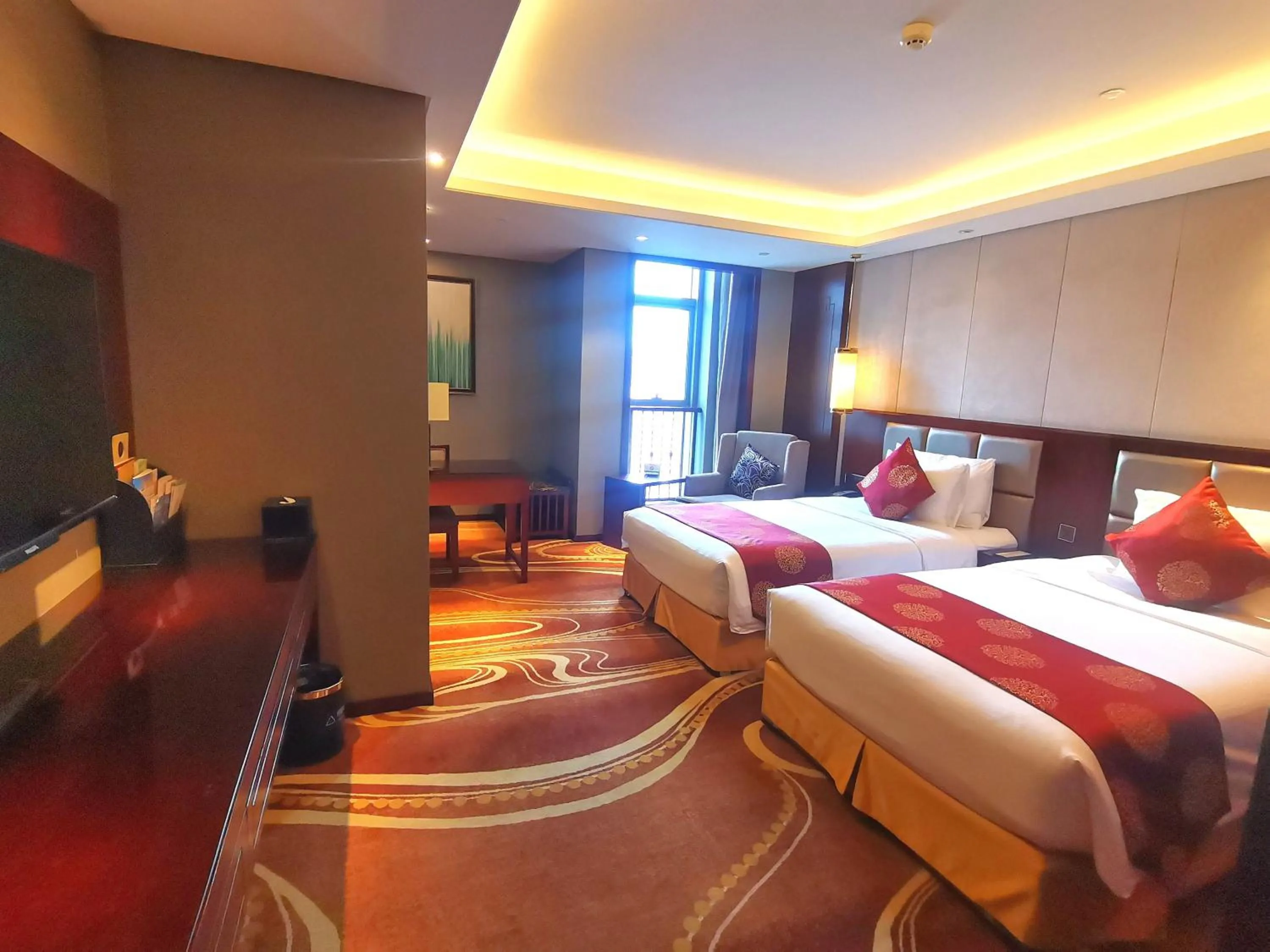 Bed in New Century Grand Hotel