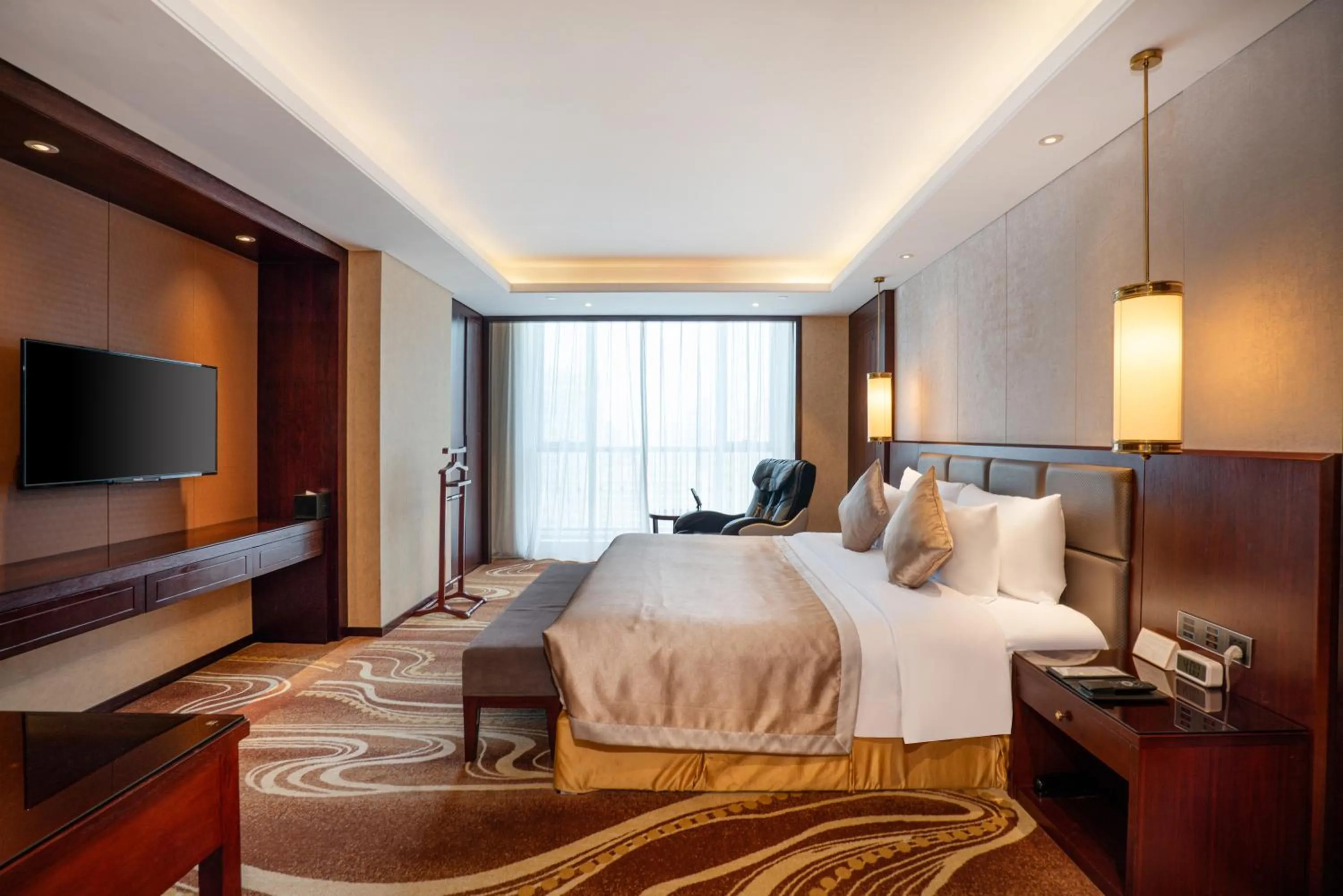 Bed in New Century Grand Hotel