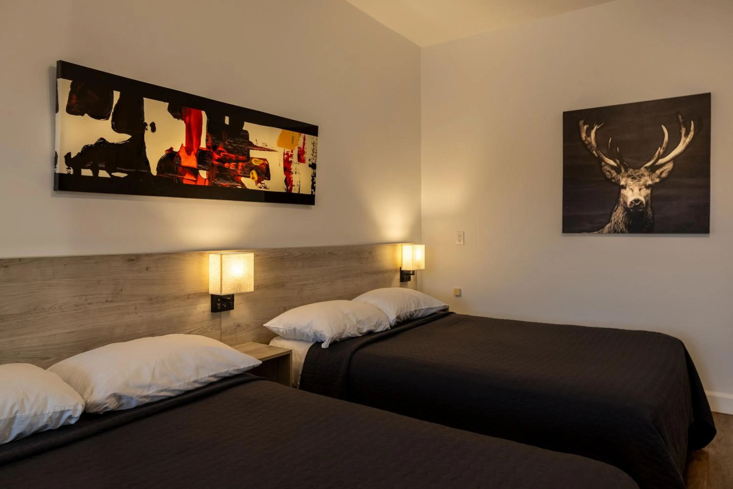 Bed in Motel Et Condo Chez Charley