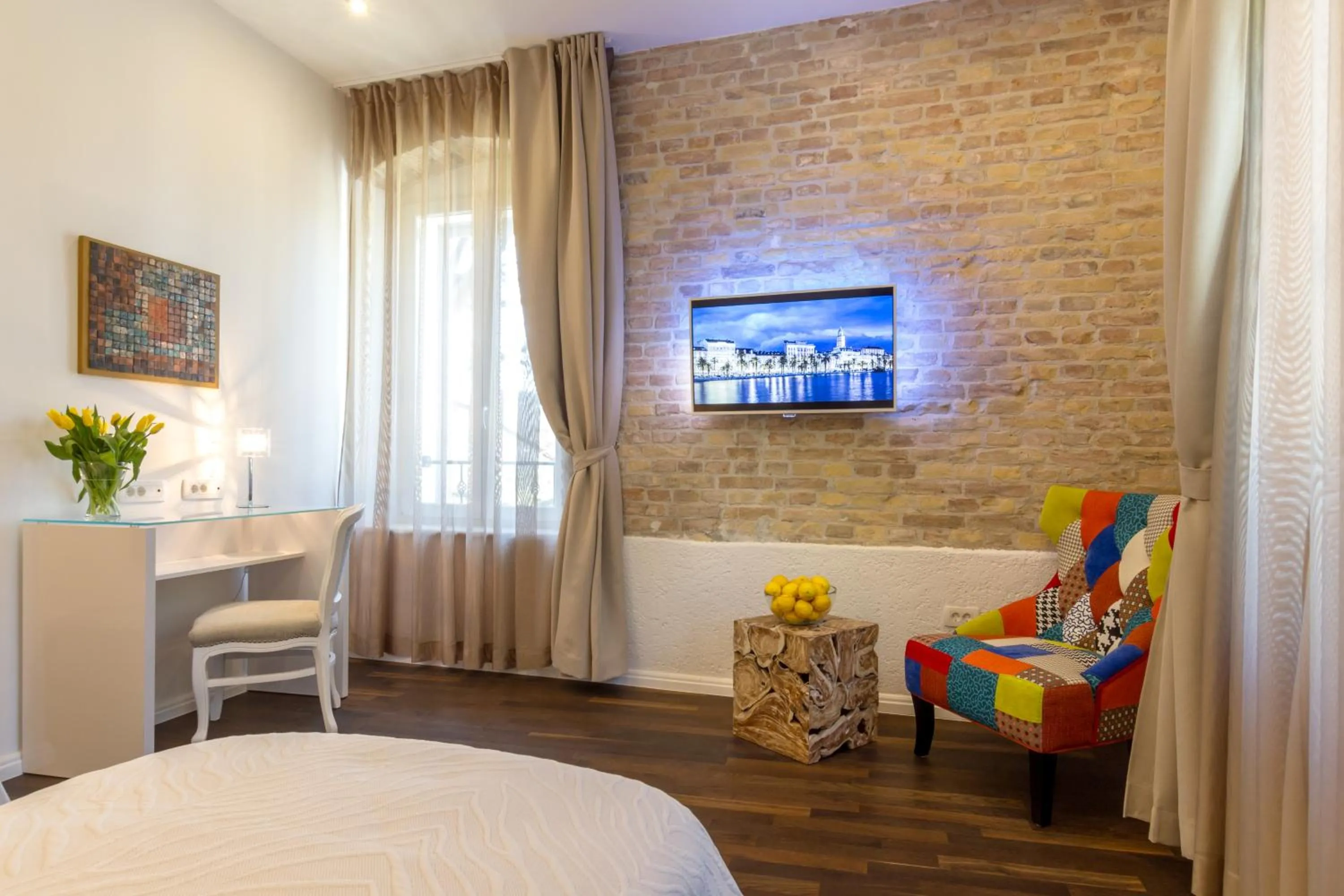 Seating area, Bed in Pellegrini Luxury Rooms