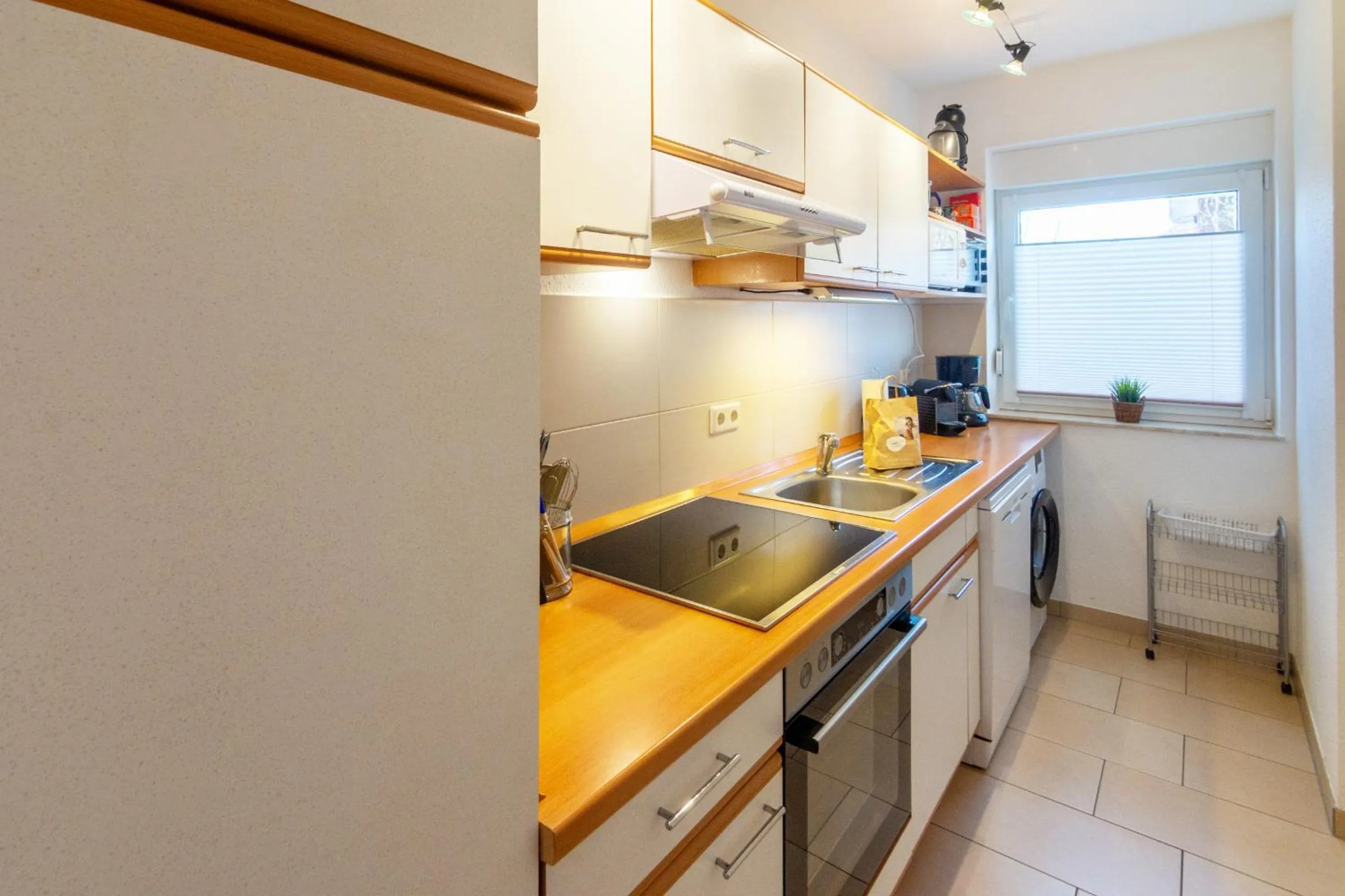 Kitchen or kitchenette in Ferienhaus Inselrosen