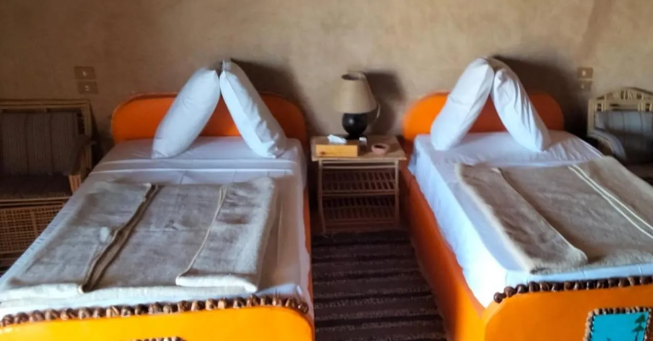 Bed in Qasr El Bagawat Hotel
