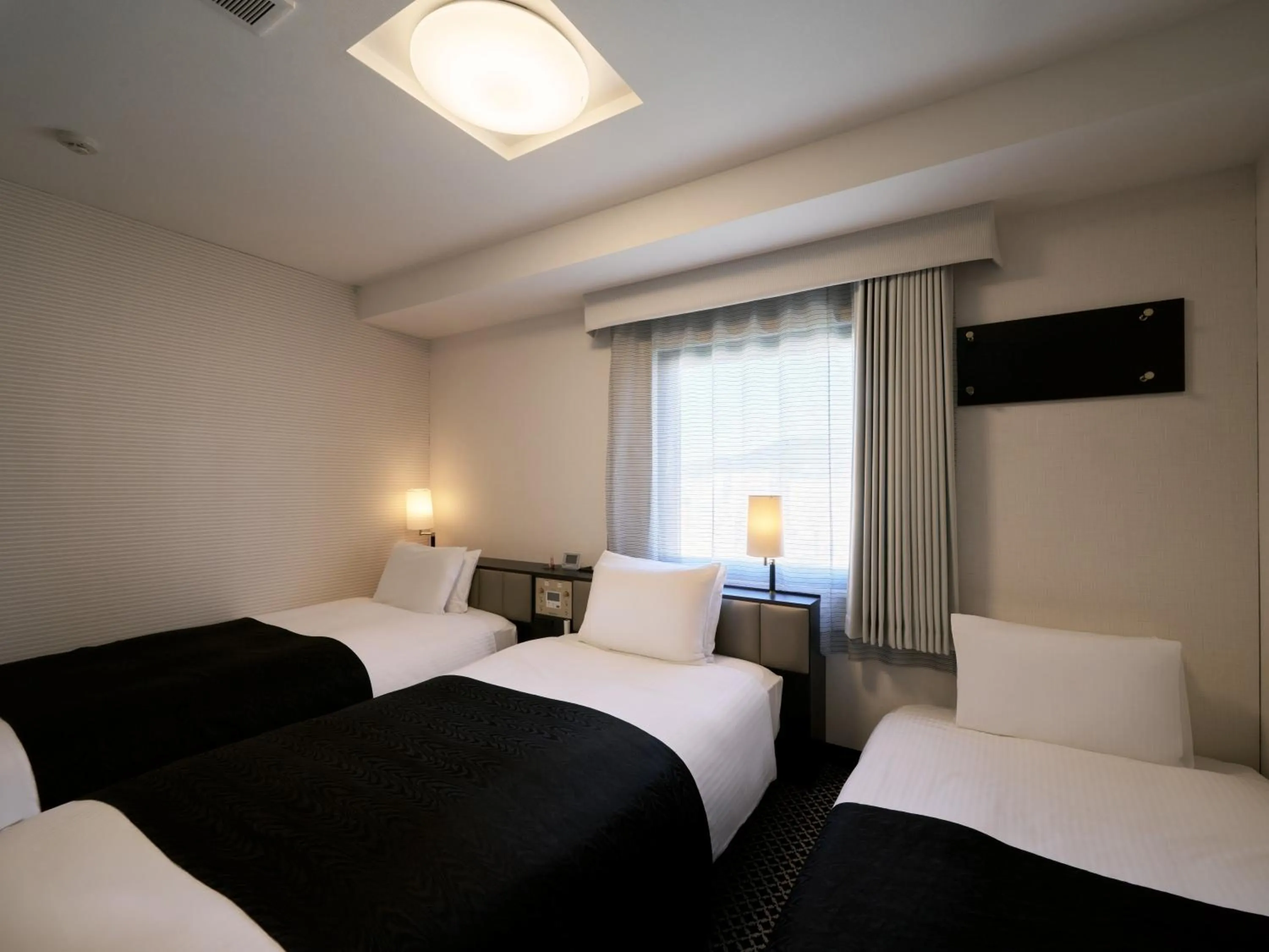 Photo of the whole room, Bed in APA Hotel Hiroshima Ekimae Ohashi