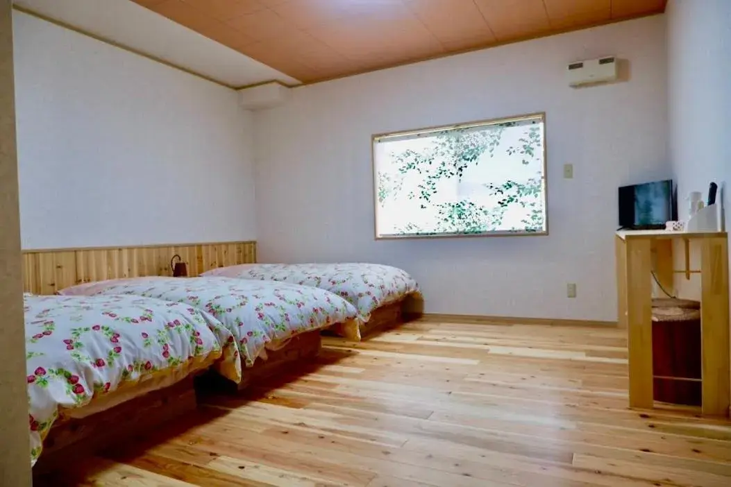 Bed in Yakushima Pension Ichigoichie Bed in Yakushima Pension Ichigoichie
