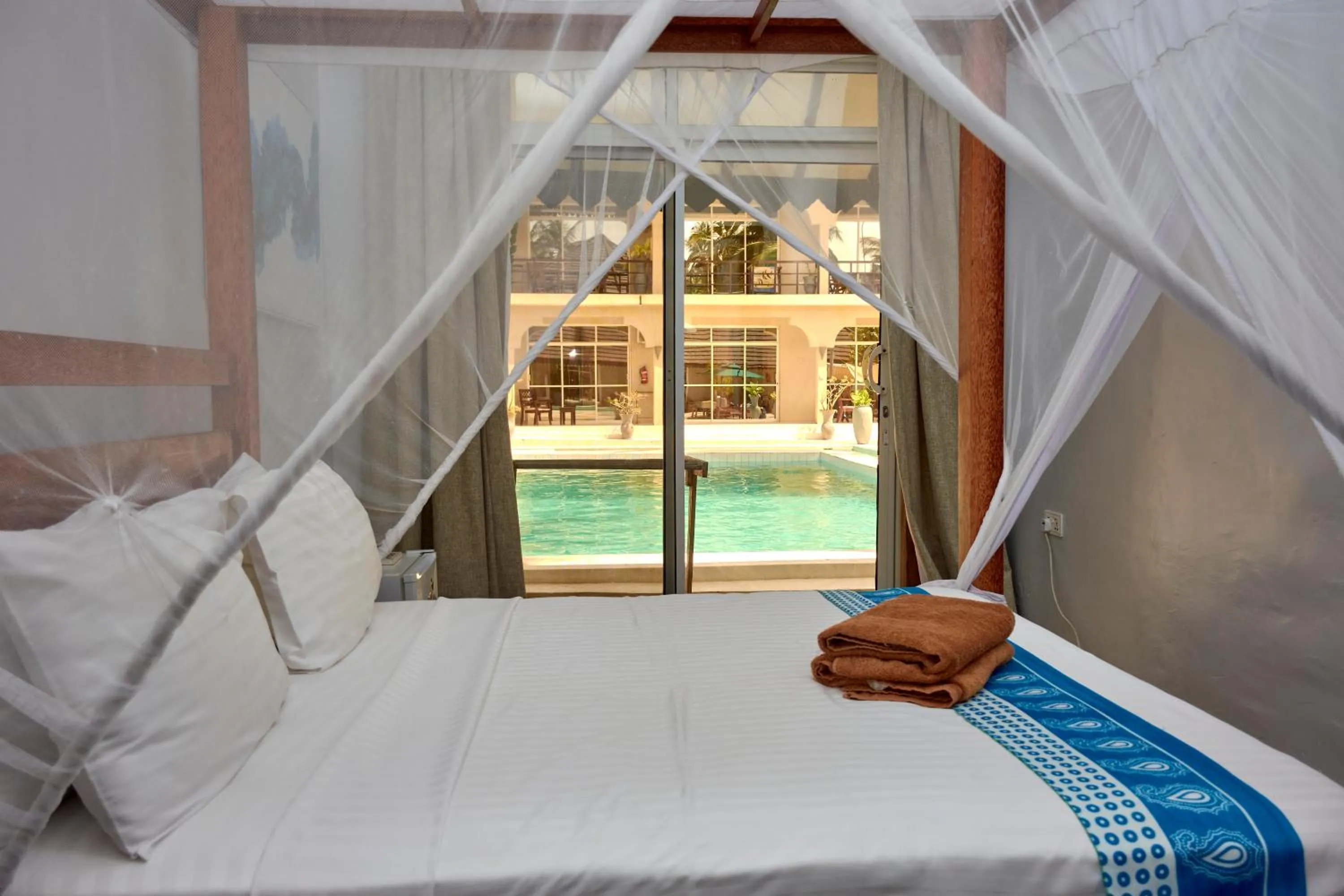 Bed in Paje Beach Apartments & Hotel