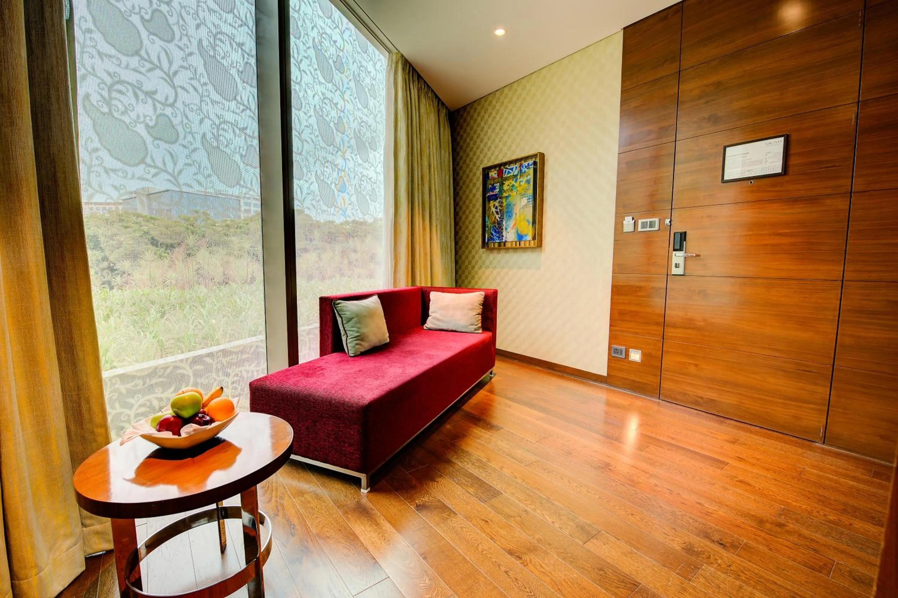 Living room, Bed in Niranta Transit Hotel Mumbai Airport - At Arrivals