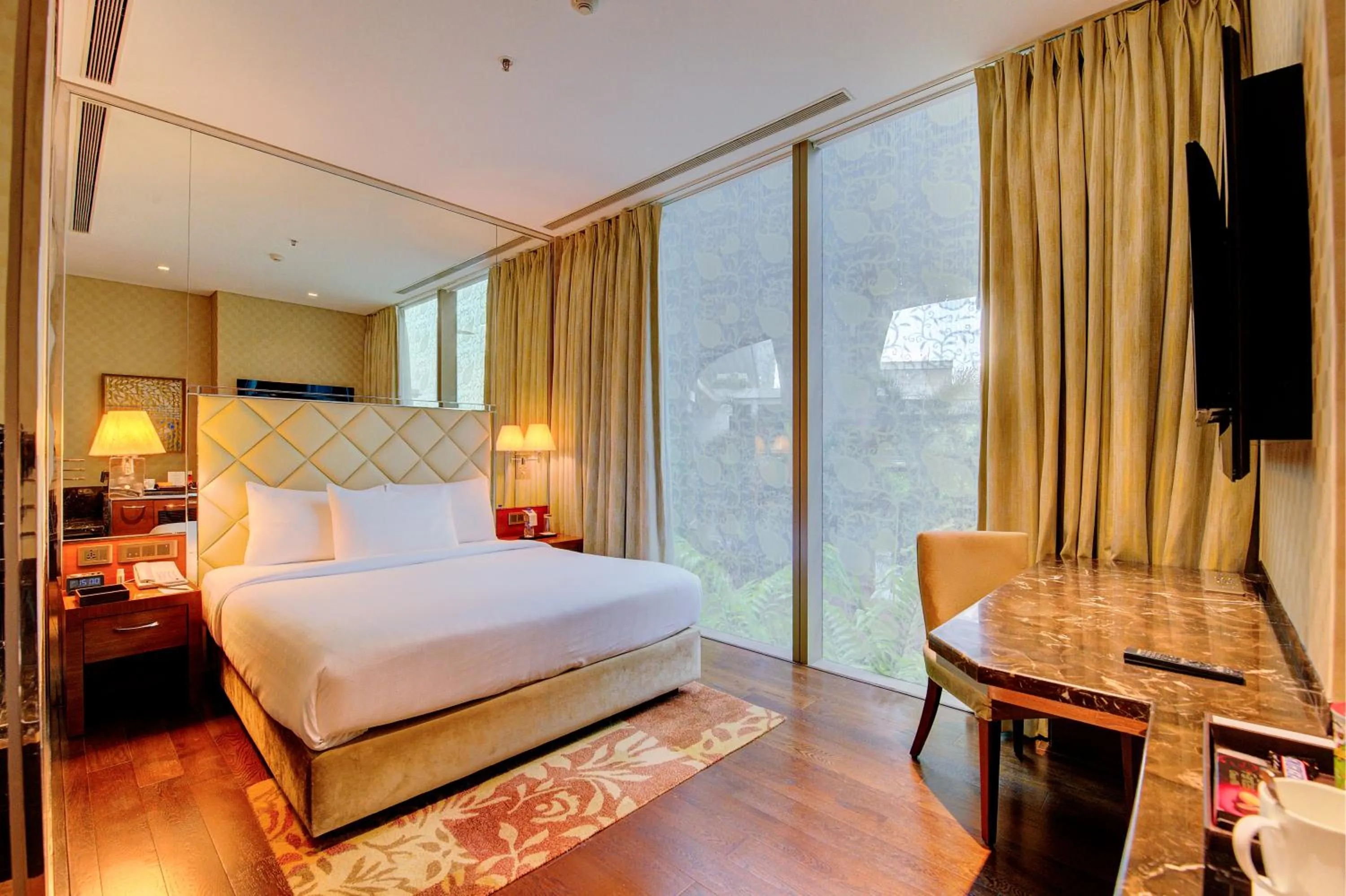 Photo of the whole room, Bed in Niranta Transit Hotel Mumbai Airport - At Arrivals