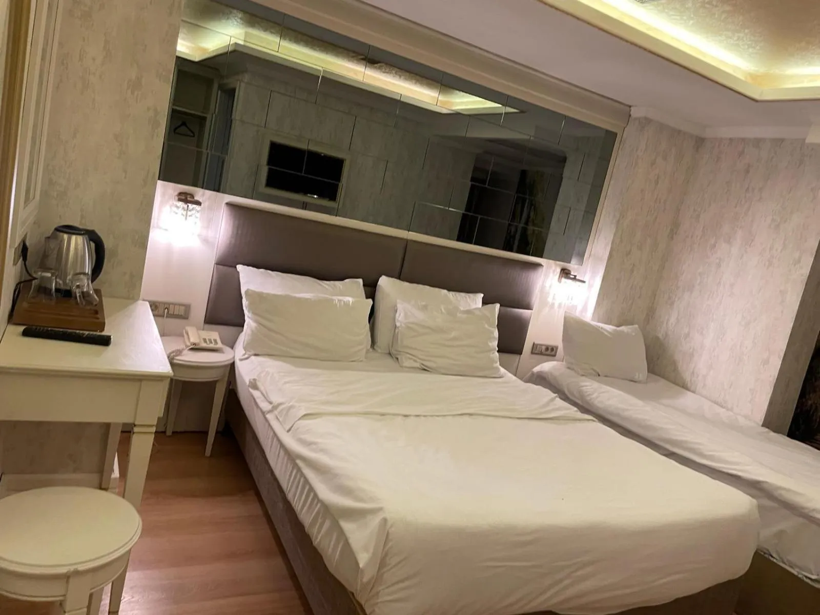 Bed in Grand Naki Hotel