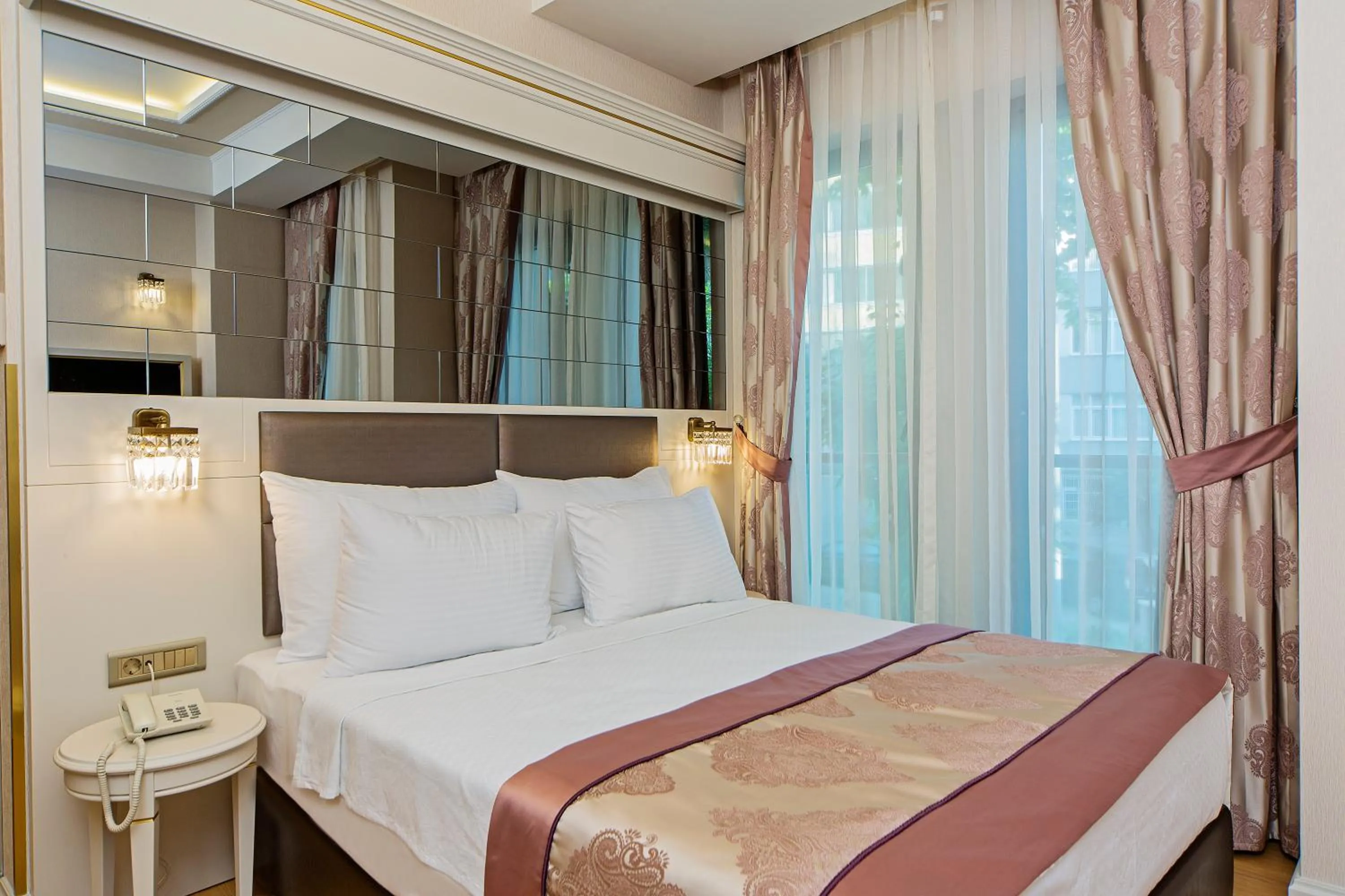 Bed in Grand Naki Hotel