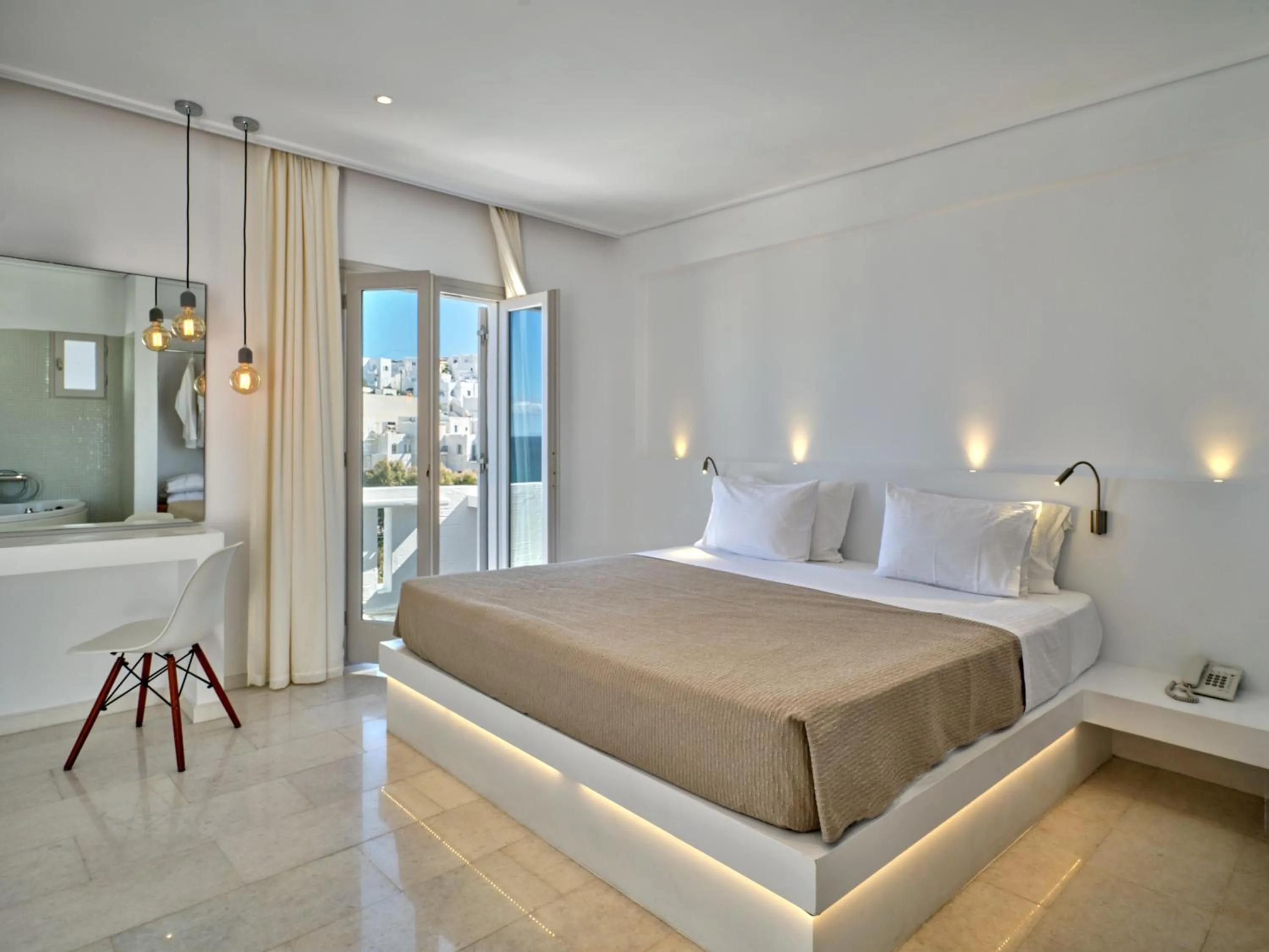 Bed in Kanale's Rooms & Suites