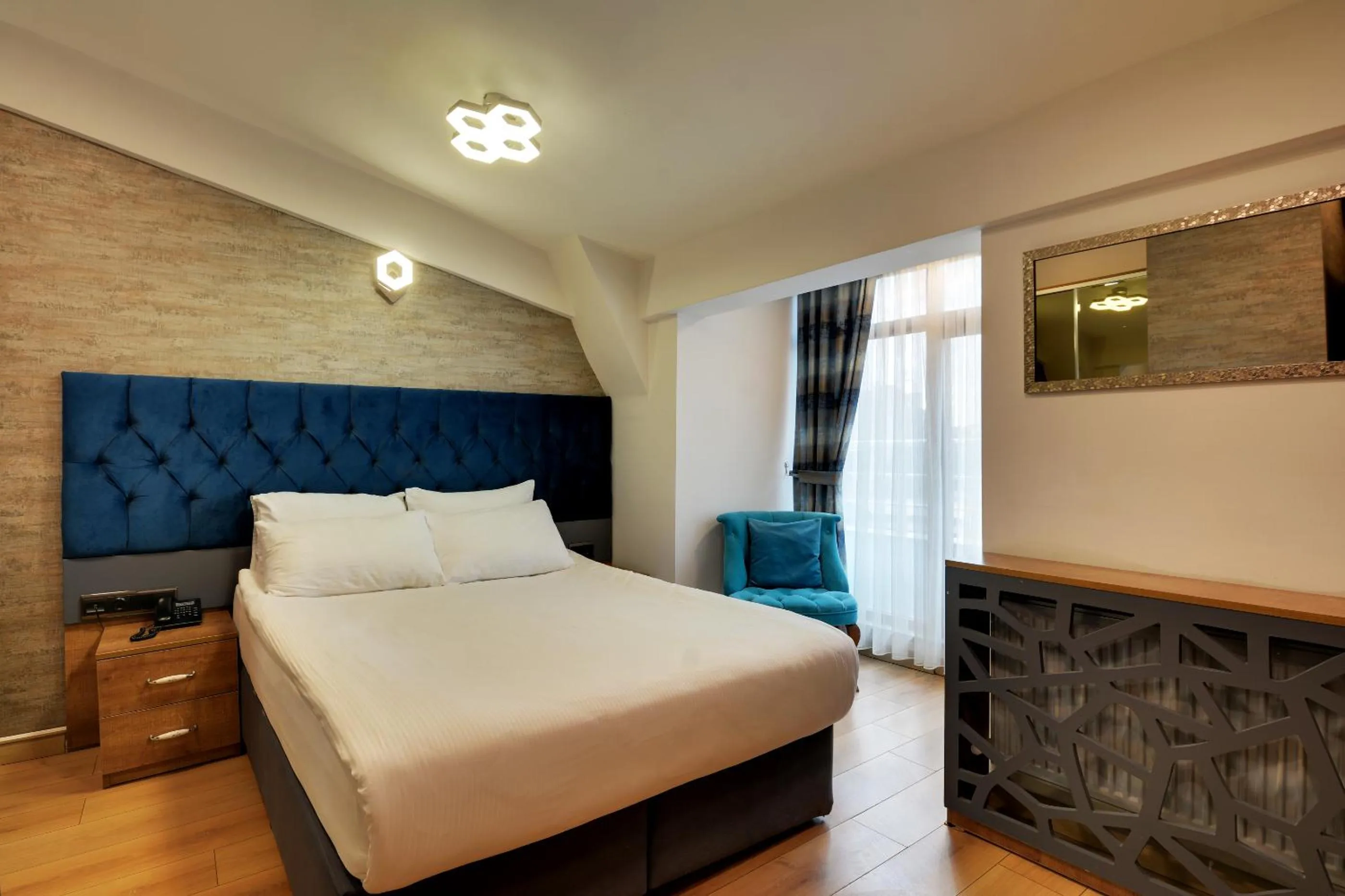 Bed in Grande Stella Hotel