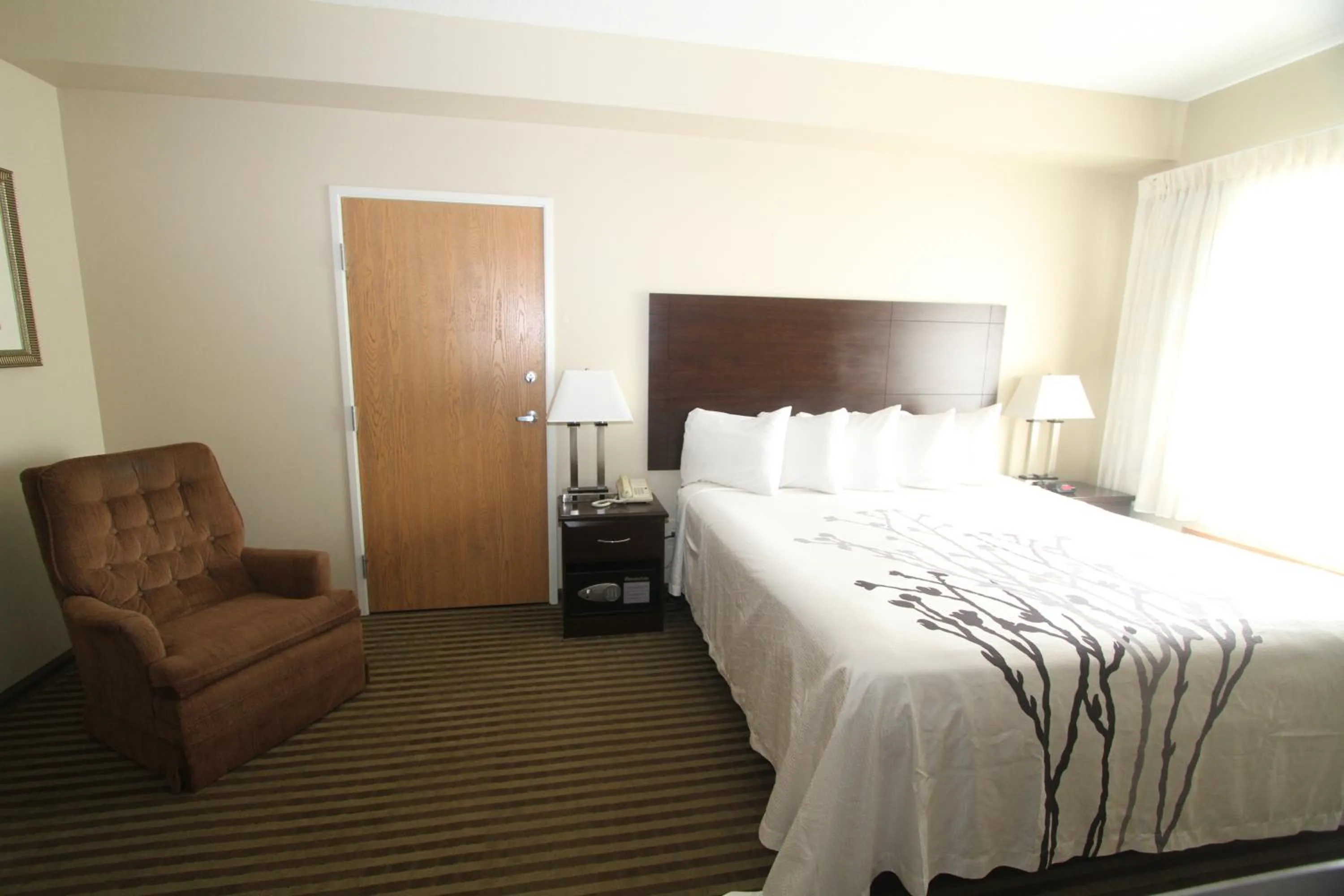 Bed in Bowman Inn and Suites