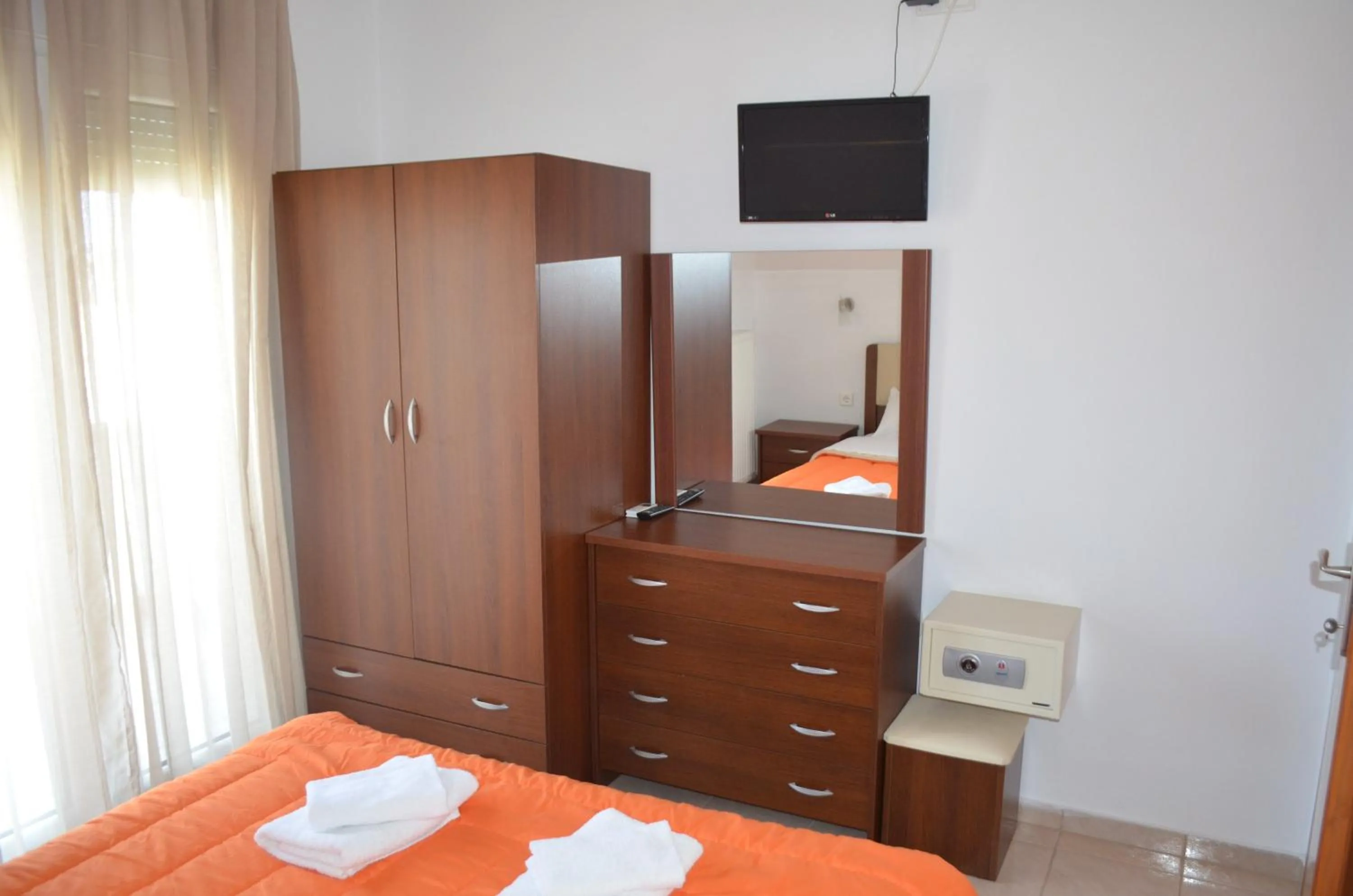 TV and multimedia, Bed in Irini Apartments