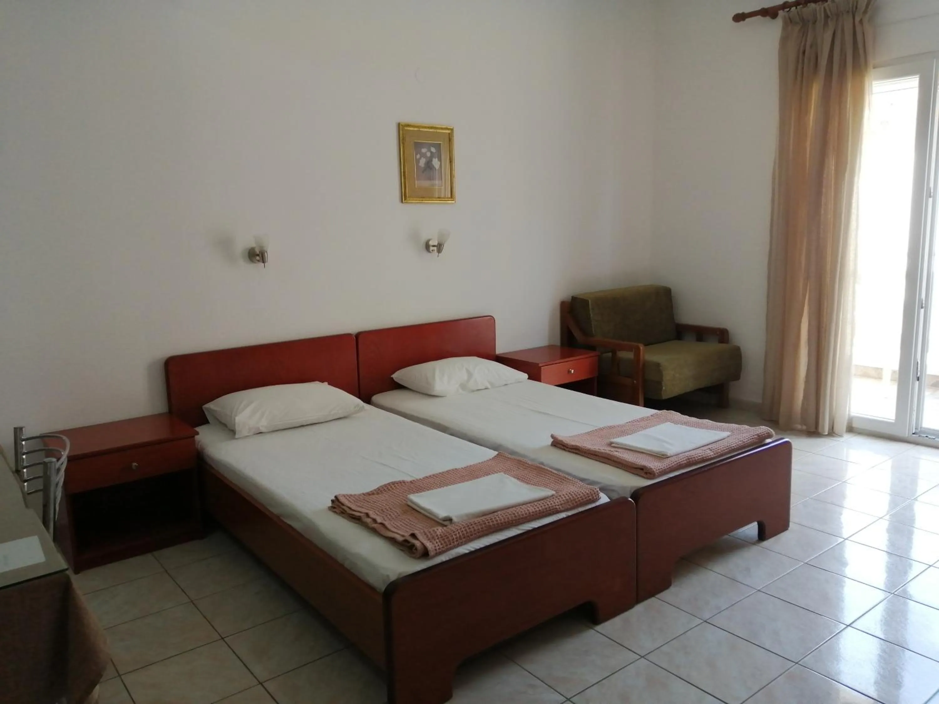 Bed in Irini Apartments