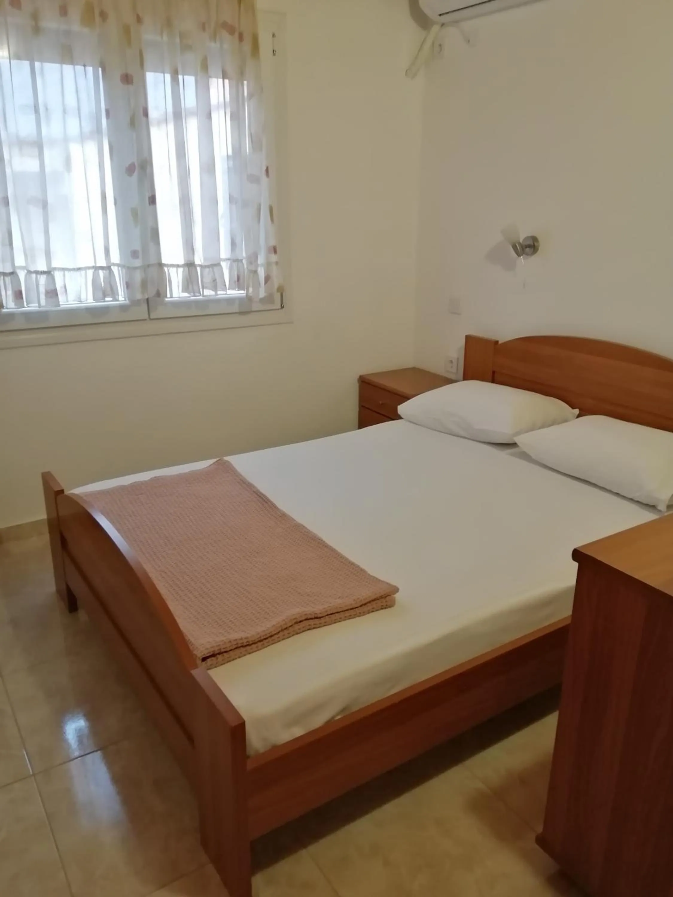 Bed in Irini Apartments
