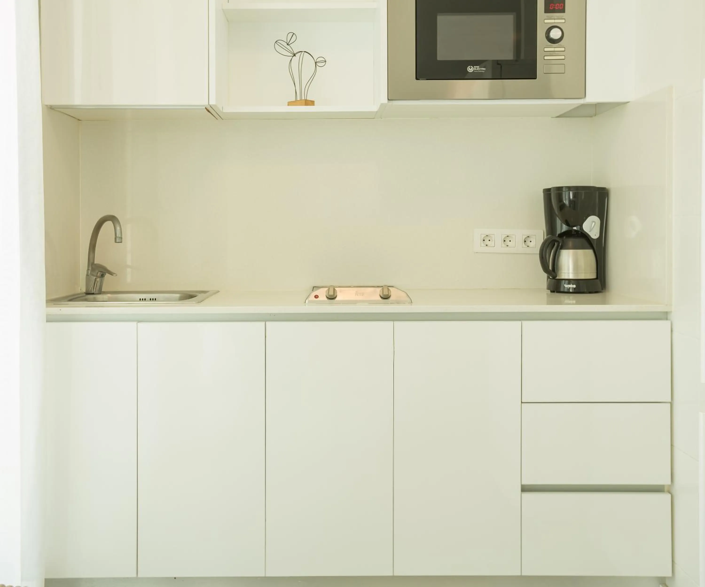 Kitchen or kitchenette in Bungalows Doña Rosa