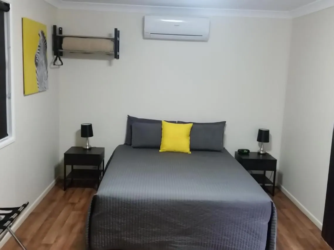 Bed in Augathella Palms Motel